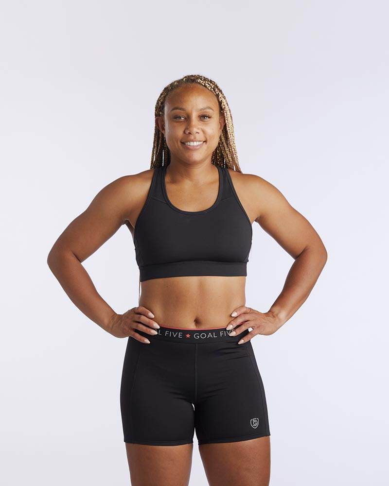 99'er Padded Sports Bra in black, with a smooth stretchy finish, scoop neckline and wide supportive underband