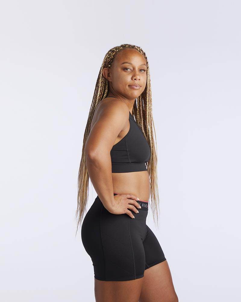 99'er Padded Sports Bra in black, smooth stretchy fabric with a simple solid design and wide shoulder straps