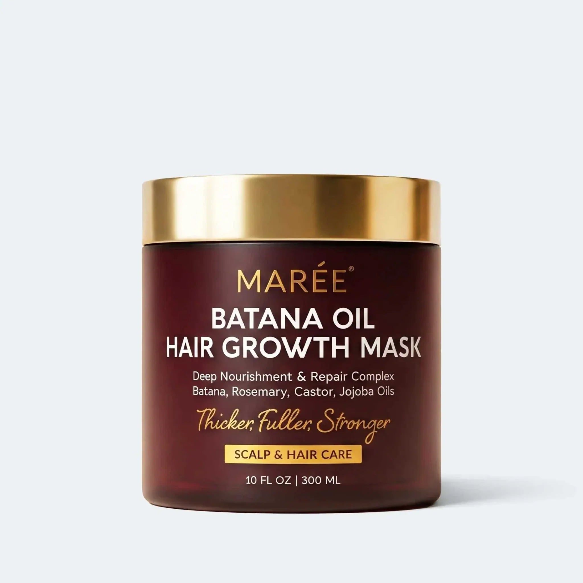 Batana Hair Growth Mask in a dark brown jar with a gold lid and gold and white lettering