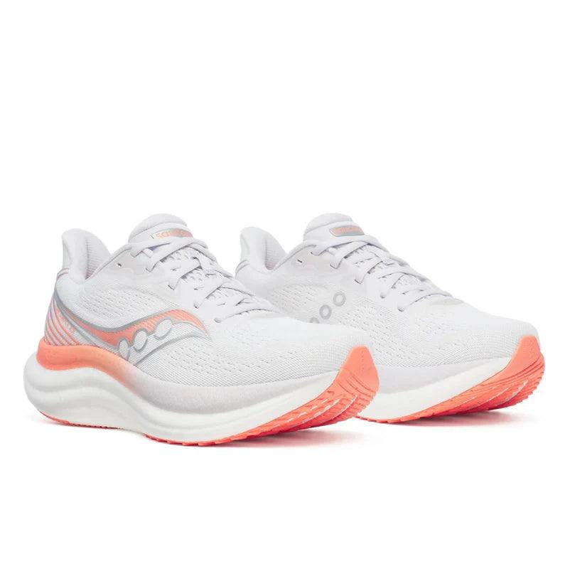 Saucony Women's Triumph 23 running shoes in white mesh with coral orange sole accents and streamlined lace-up design