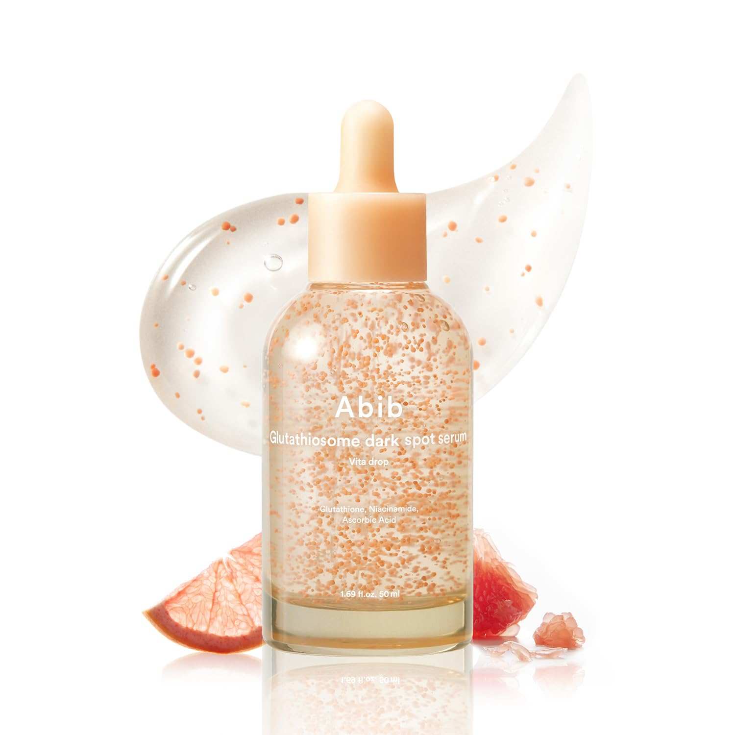 Abib Glutathiosome Dark Spot Serum in a clear glass bottle with a peach dropper cap and visible orange specks inside the serum
