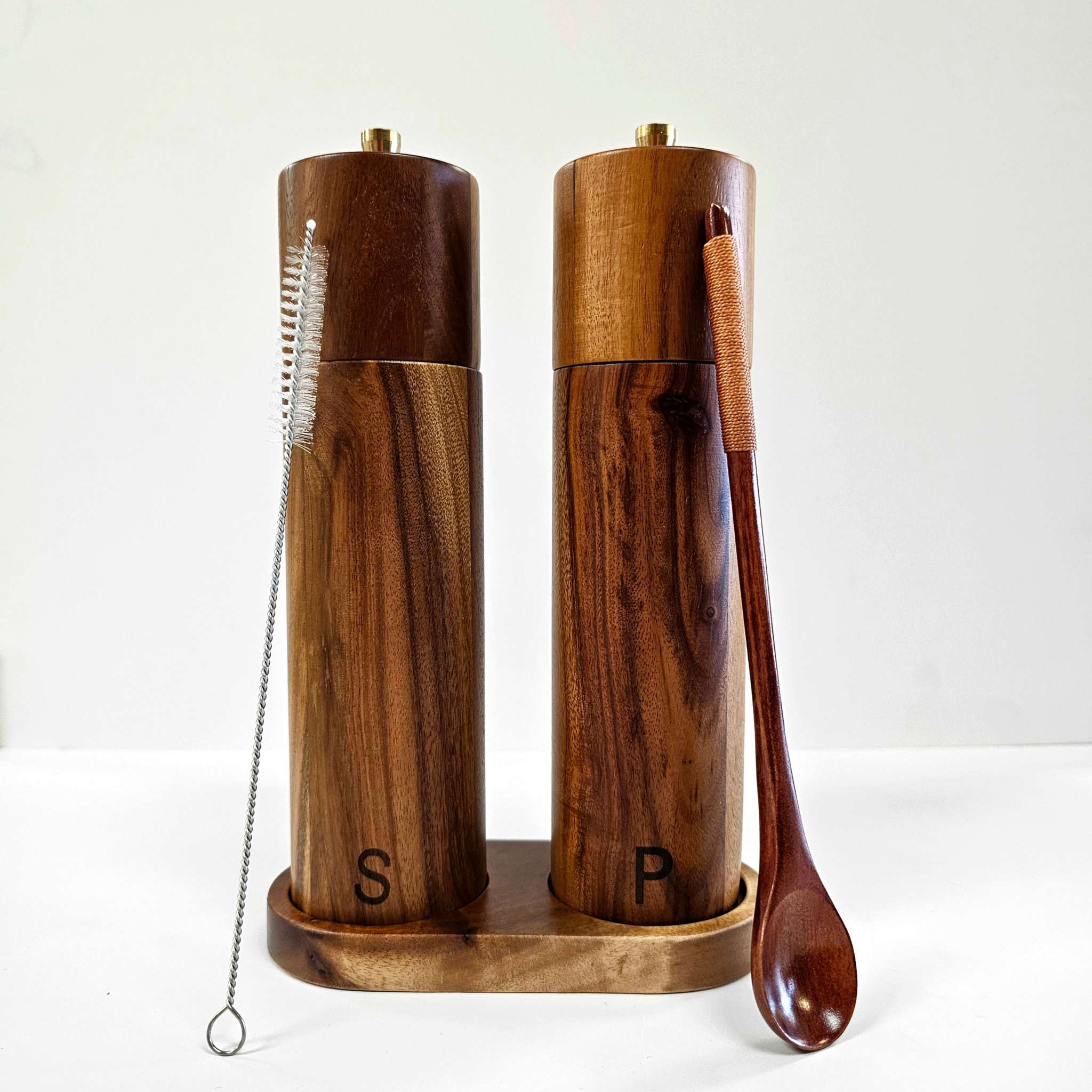 Acacia Wood salt and pepper grinder set in dark brown polished wood, with an S and P marking and matching tray