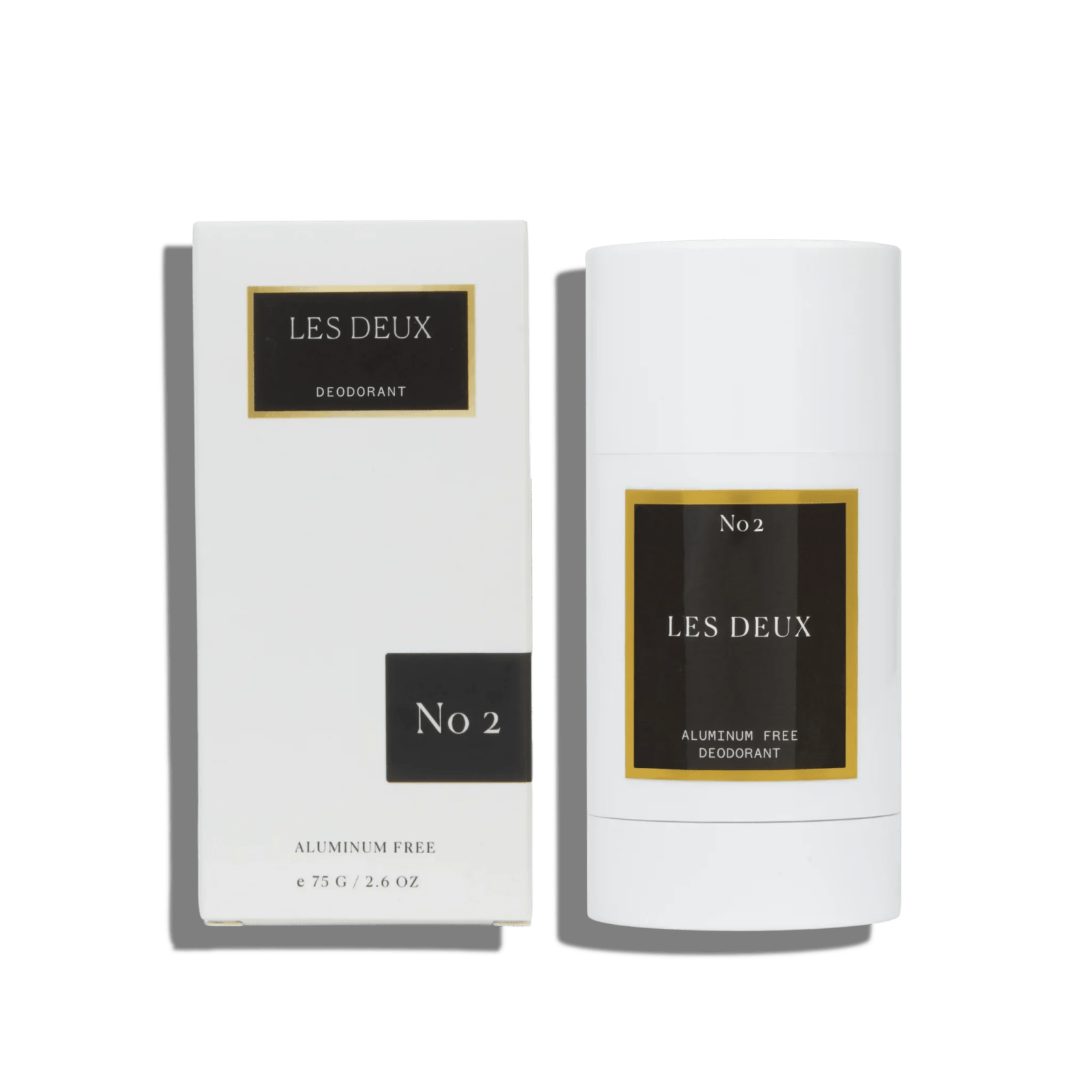 No. 2 Les Deux aluminum free deodorant in a white stick with black and gold label, next to its matching white box with black and gold details.