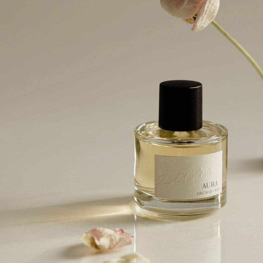 AURA Perfume bottle with grapefruit and tonka bean scent