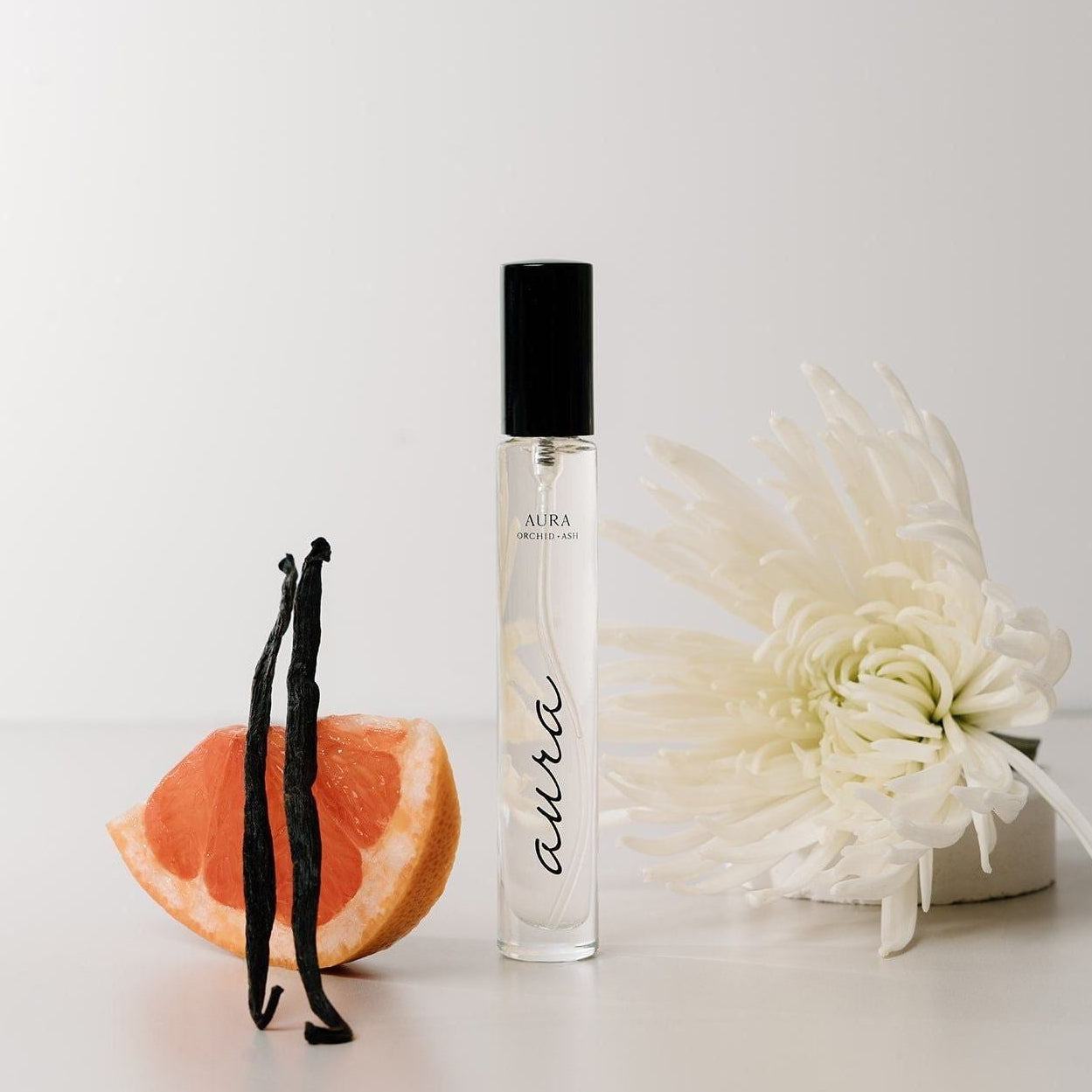 AURA Perfume Travel Spray bottle with grapefruit and tonka bean fragrance