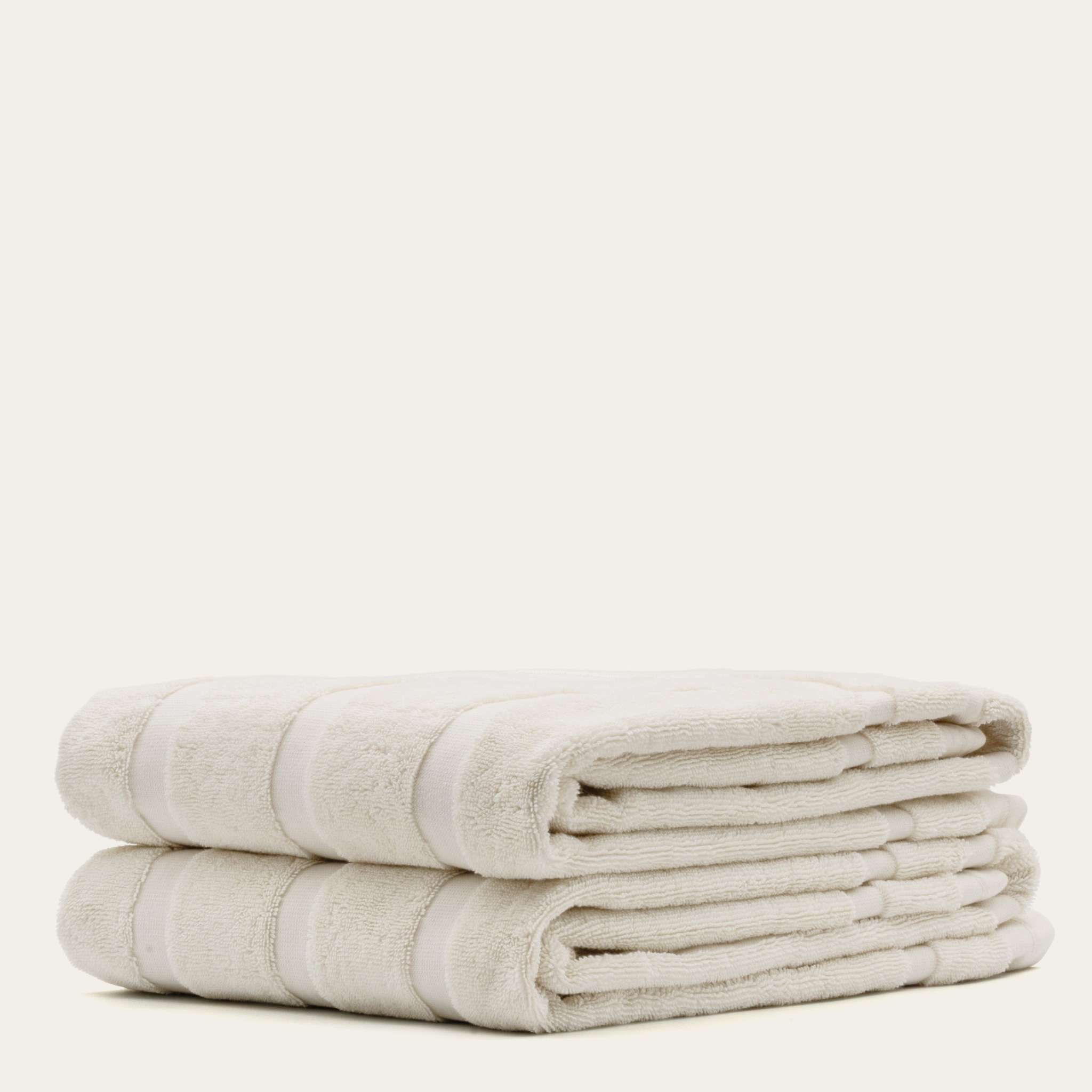 Australian Cotton towels in soft ecru color with subtle striped pattern, plush and dense 600 GSM cotton fabric