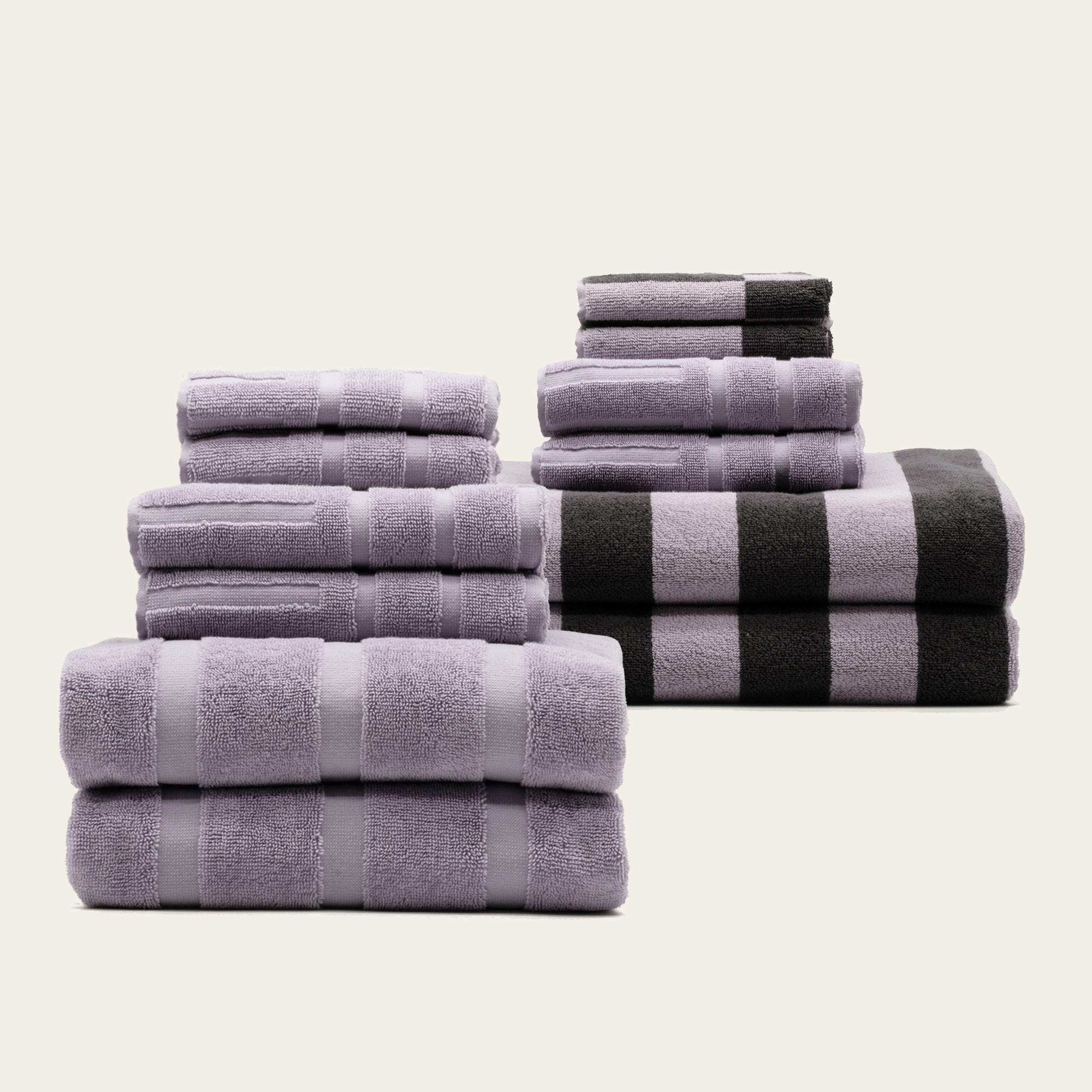 Australian Cotton towels set featuring soft lilac and black geometric striped patterns in various sizes with a plush 600 GSM texture