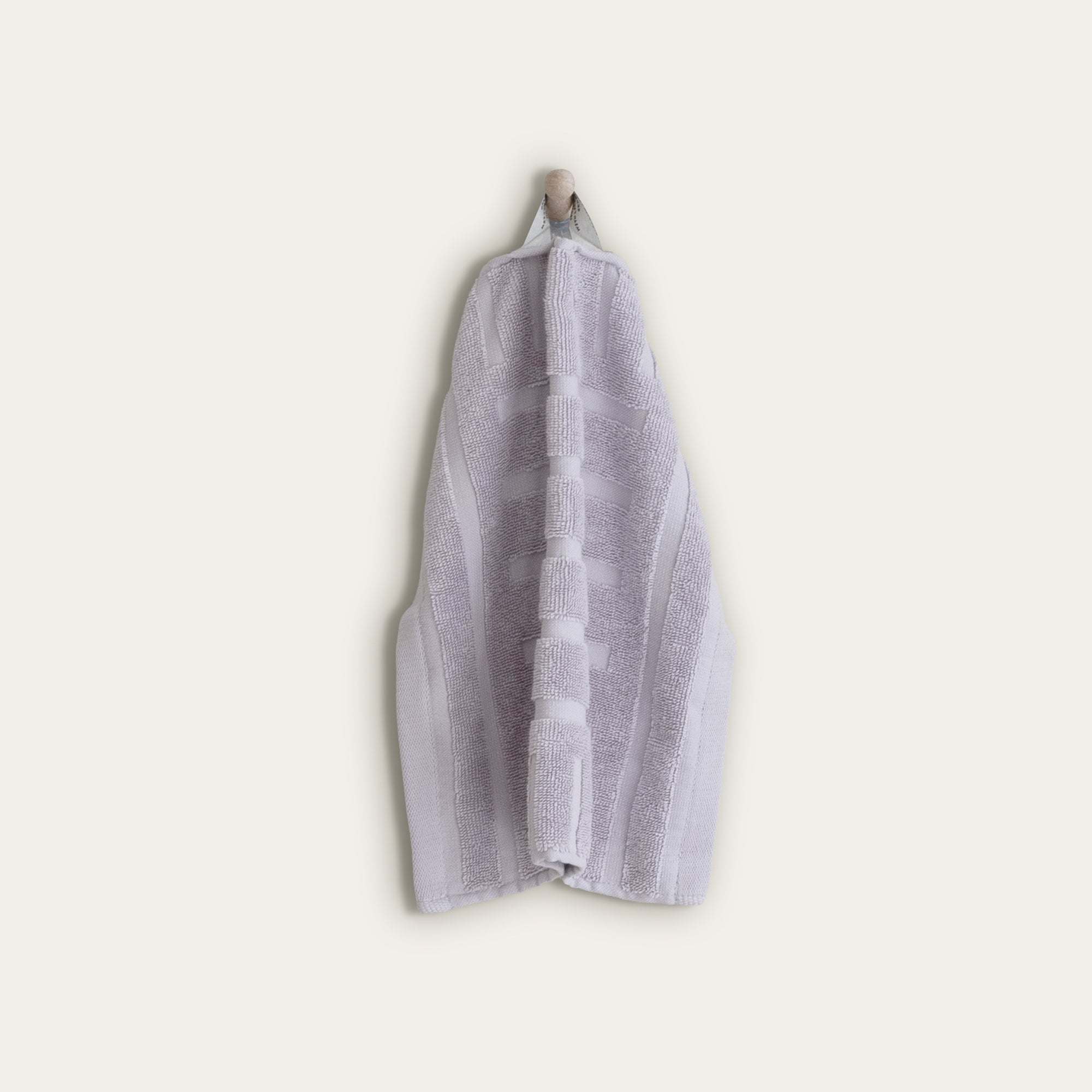 Australian Cotton towels in soft lilac with geometric patterns and a functional locker loop for easy drying