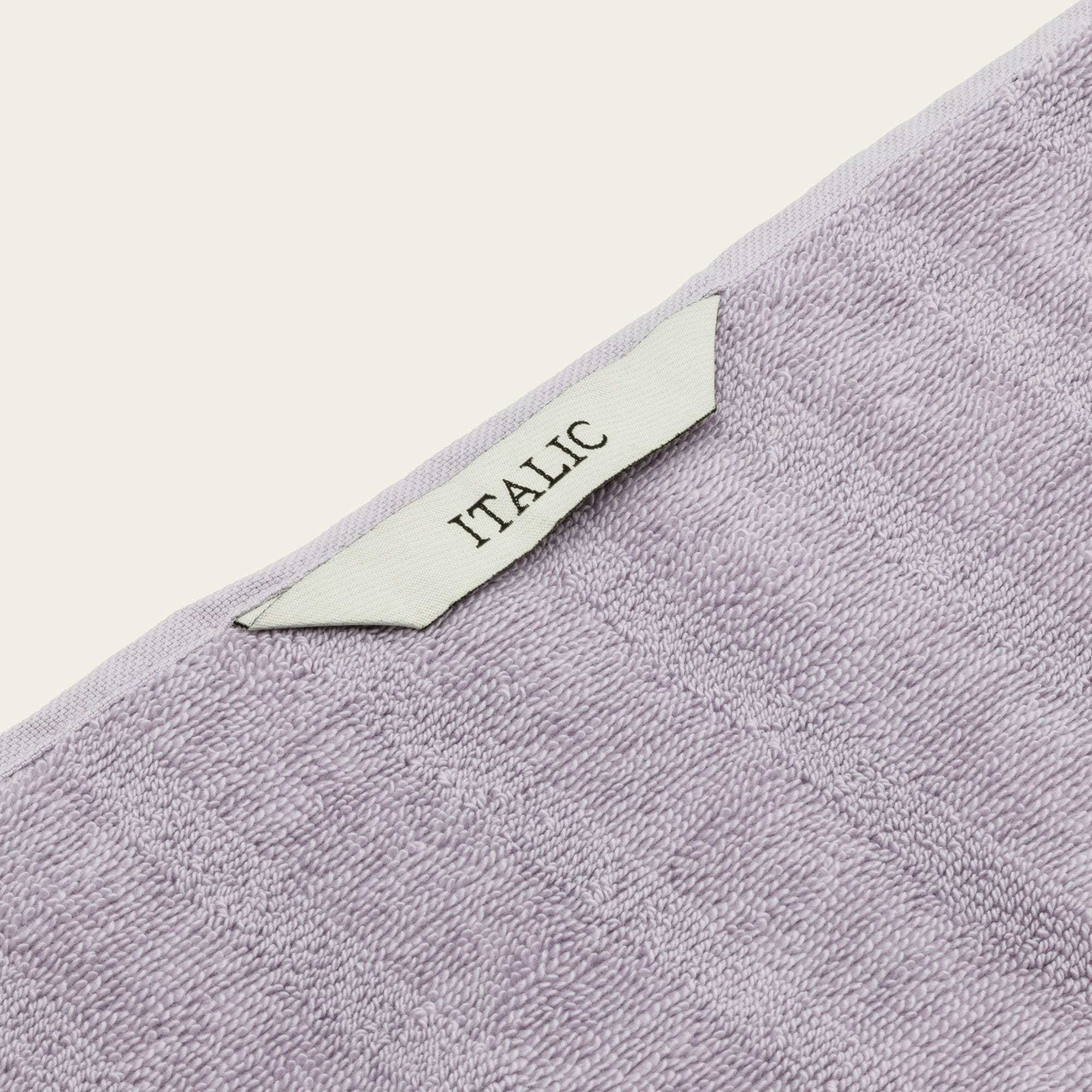 Australian Cotton towels in soft lilac color featuring a plush textured cotton fabric with a white ITALIC label