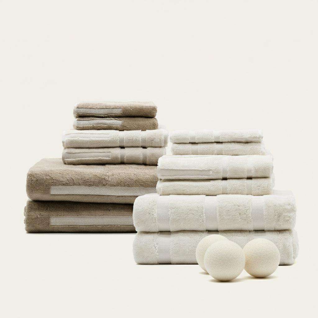 Australian Cotton towels in neutral beige and off-white colors with soft, plush texture and subtle striped pattern stacked neatly