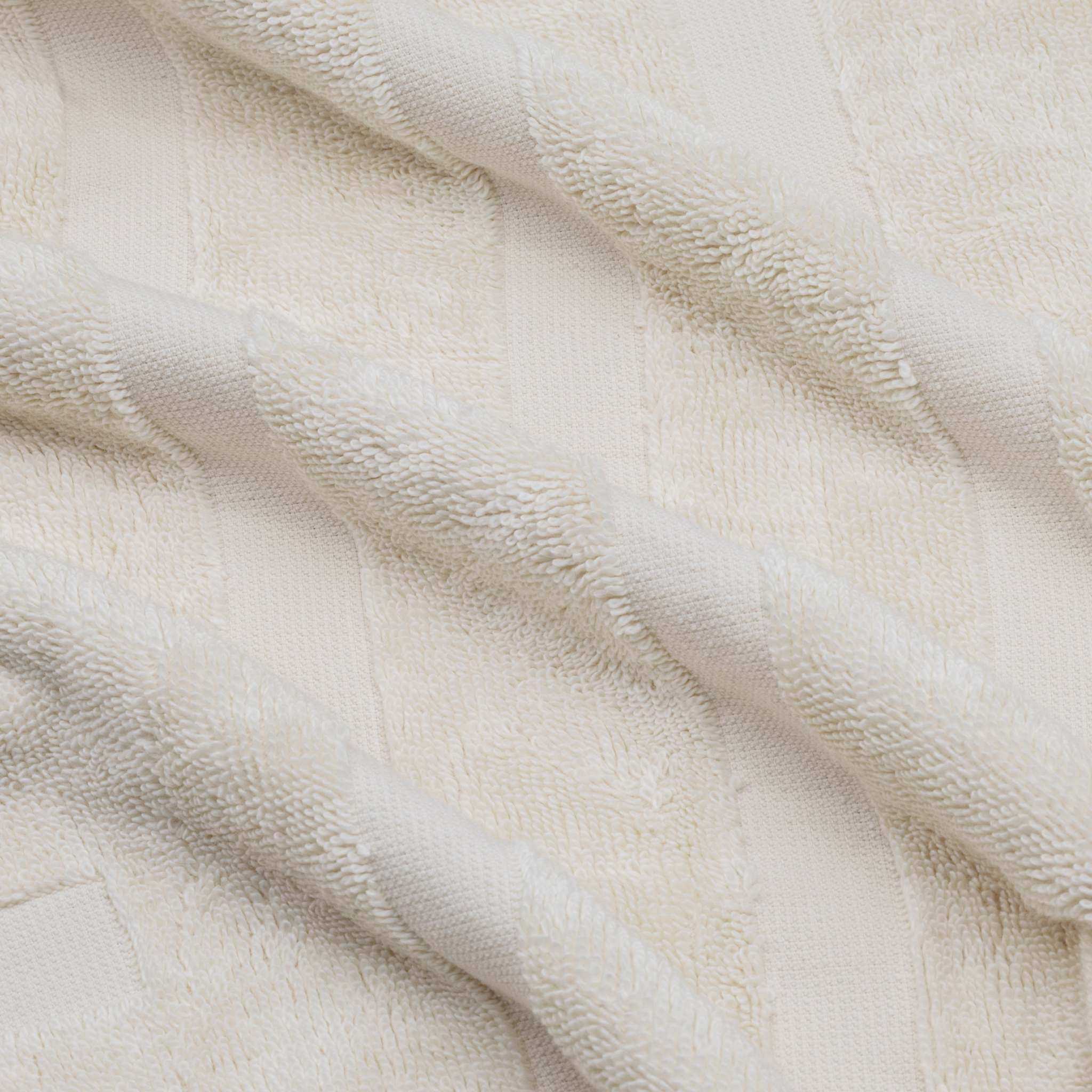 Soft off-white Australian Cotton towels featuring a subtle geometric pattern in plush 600 GSM fabric