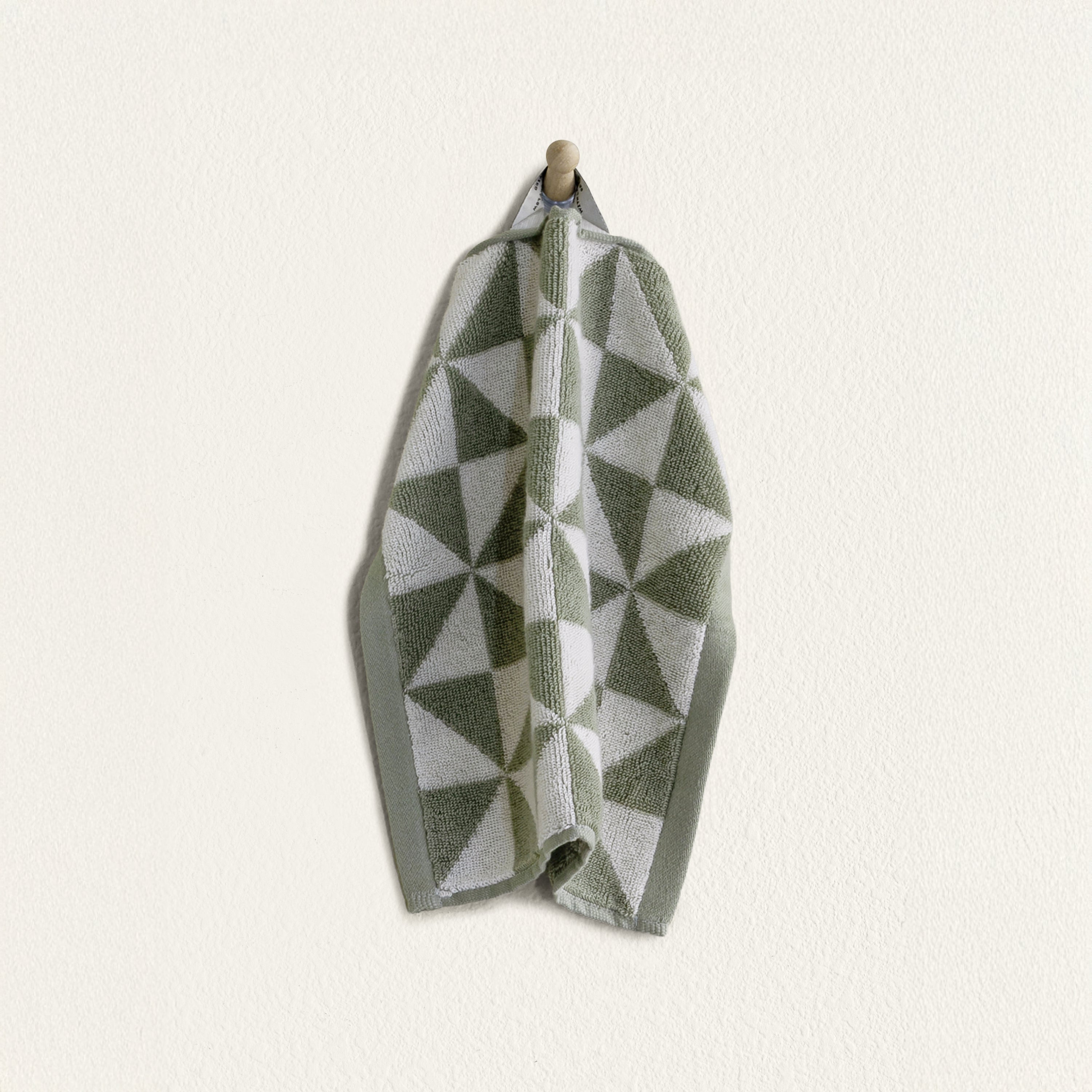 Australian Cotton Towels washcloth in sage green and white, plush cotton with a bold triangular pattern and hanging loop