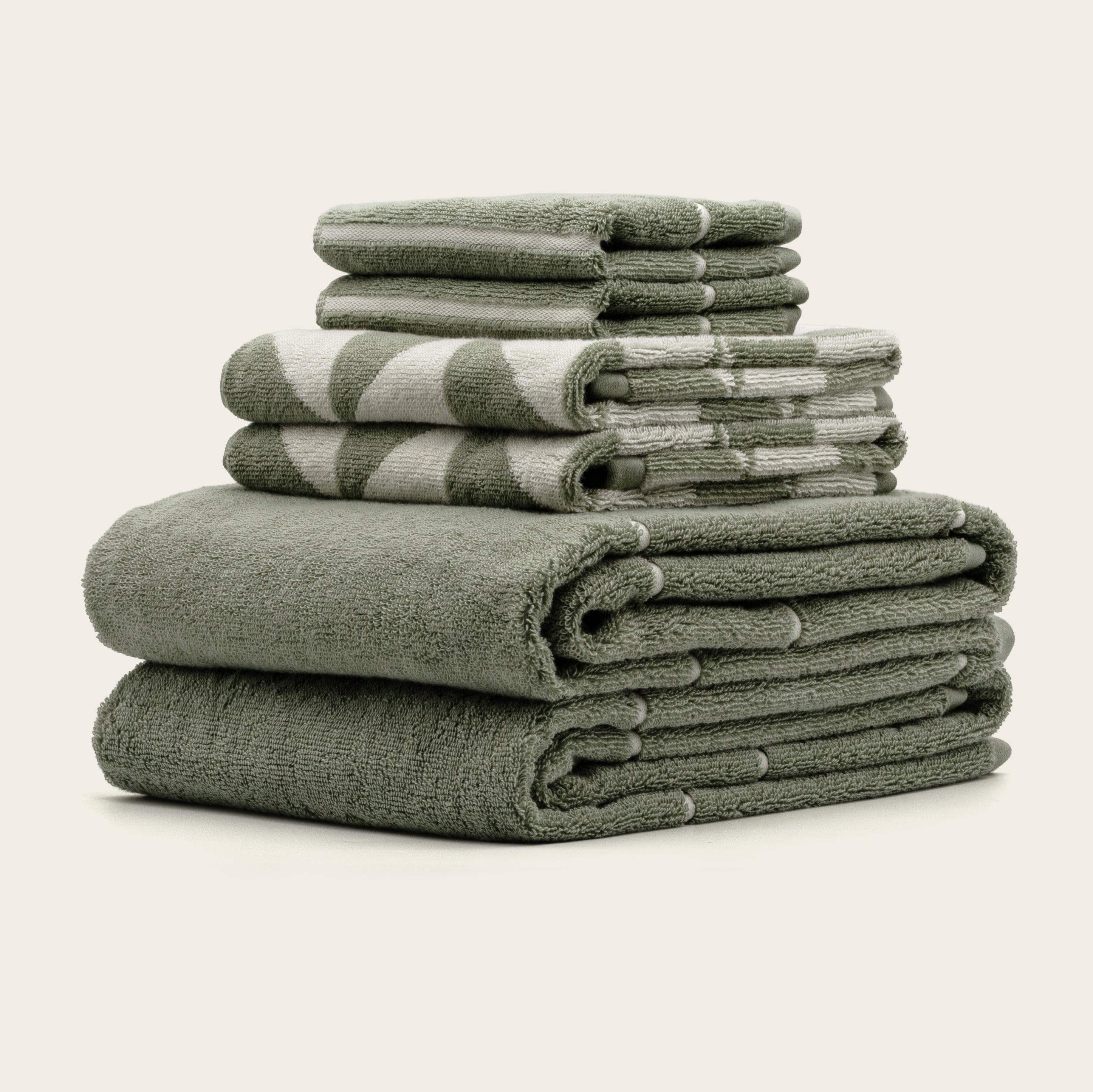 Australian Cotton Towels in muted sage green, plush textured cotton with a subtle triangular pattern on selected towels