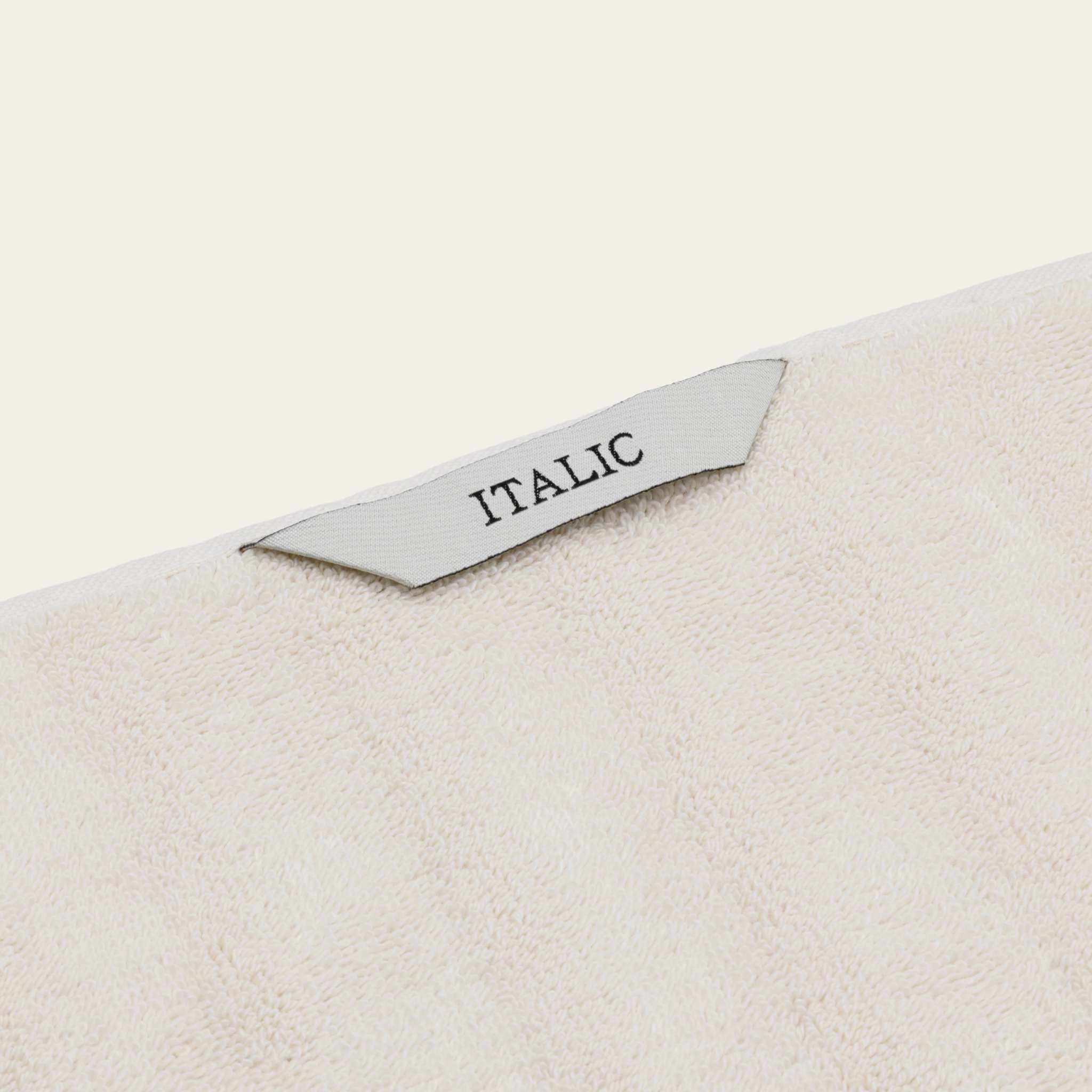 Australian Cotton towels in a soft ecru color with plush terry cotton texture and an Italic brand tag