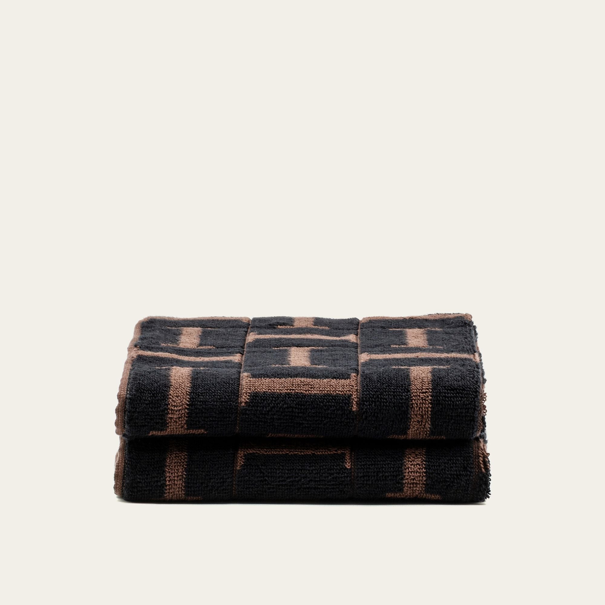 Tessera Australian cotton towels in rich coastal tones with geometric patterns
