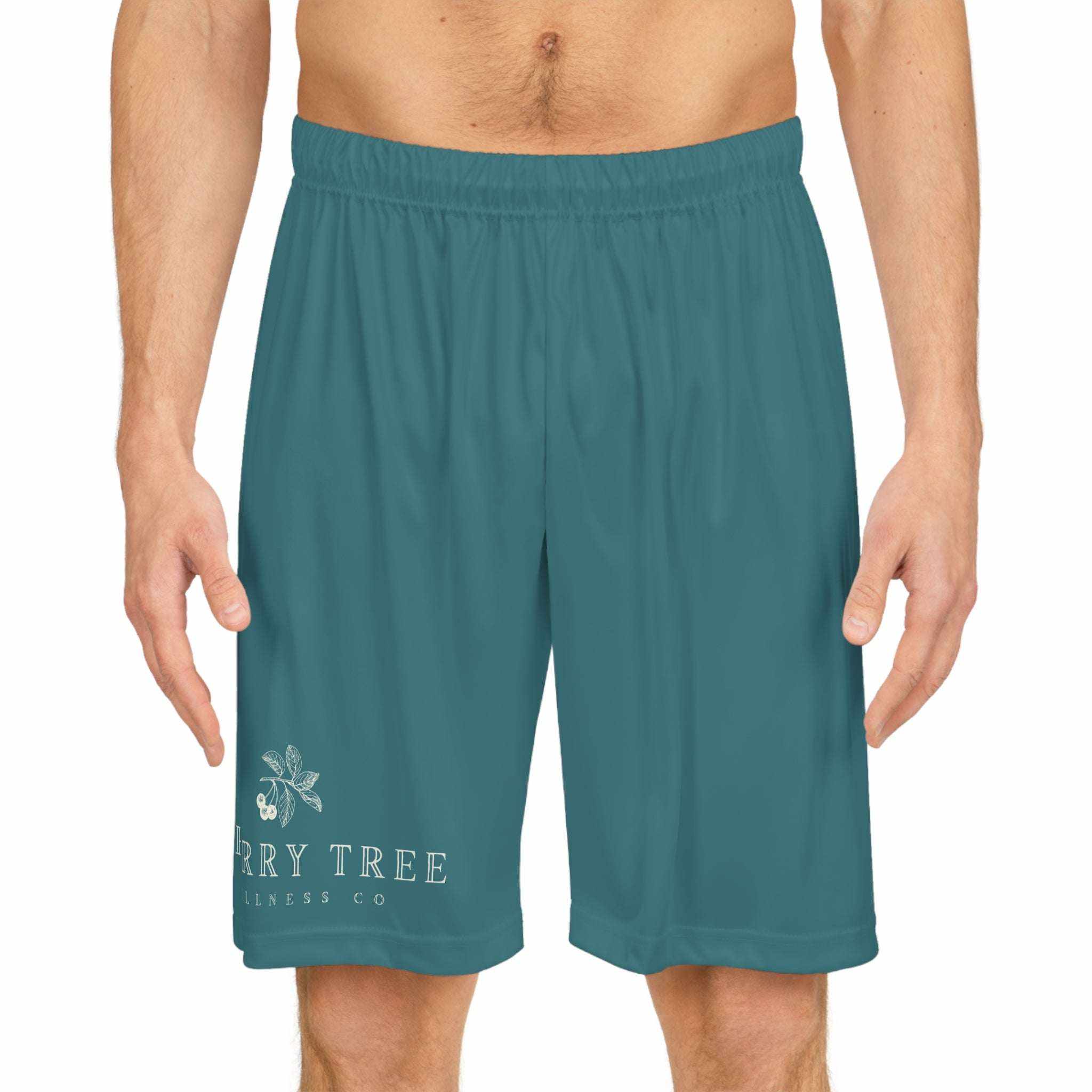 Basketball Shorts (AOP) in solid teal color with elastic waistband and white brand logo on lower left leg