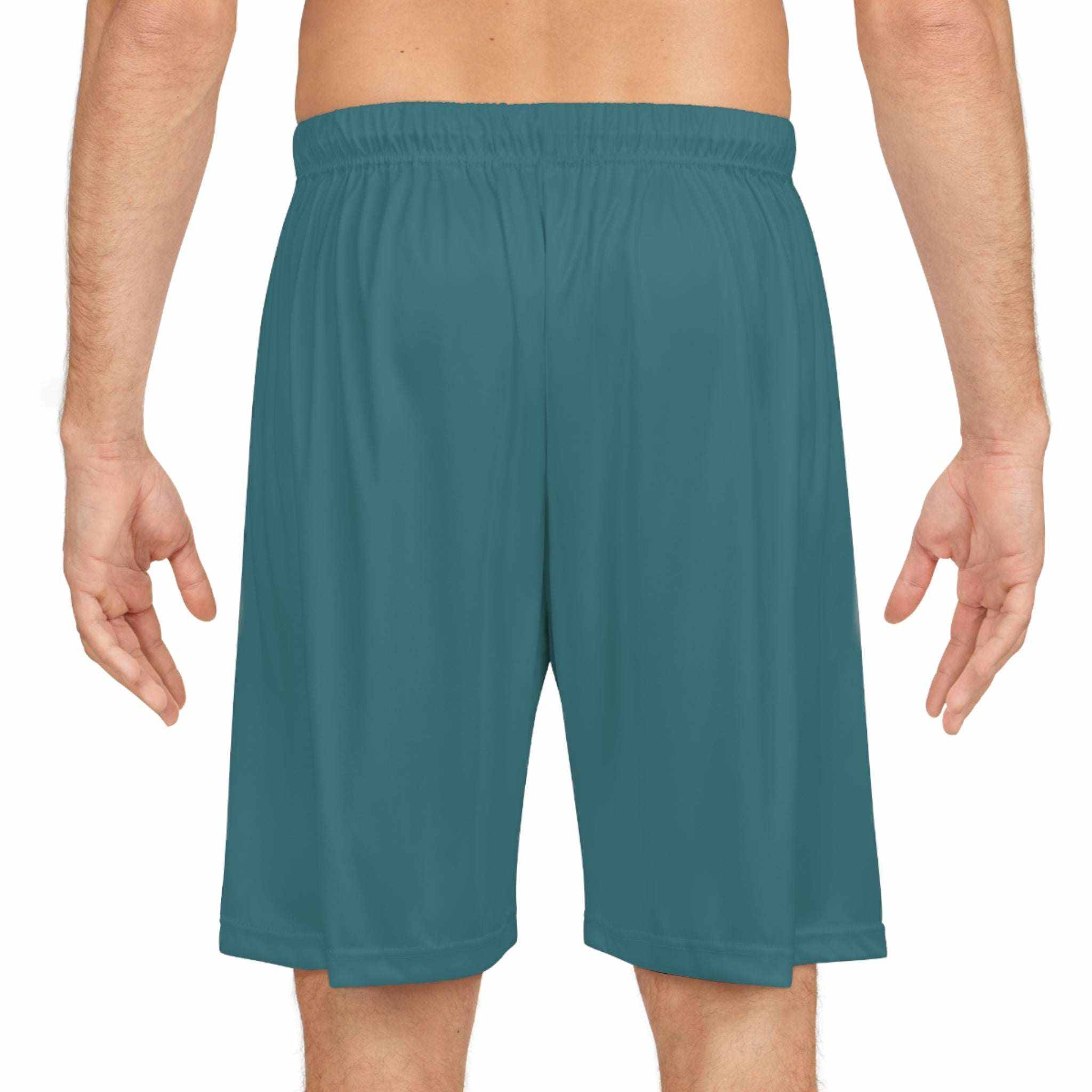 Basketball Shorts (AOP) in solid teal color with elastic waistband, lightweight moisture-wicking fabric, and no pockets