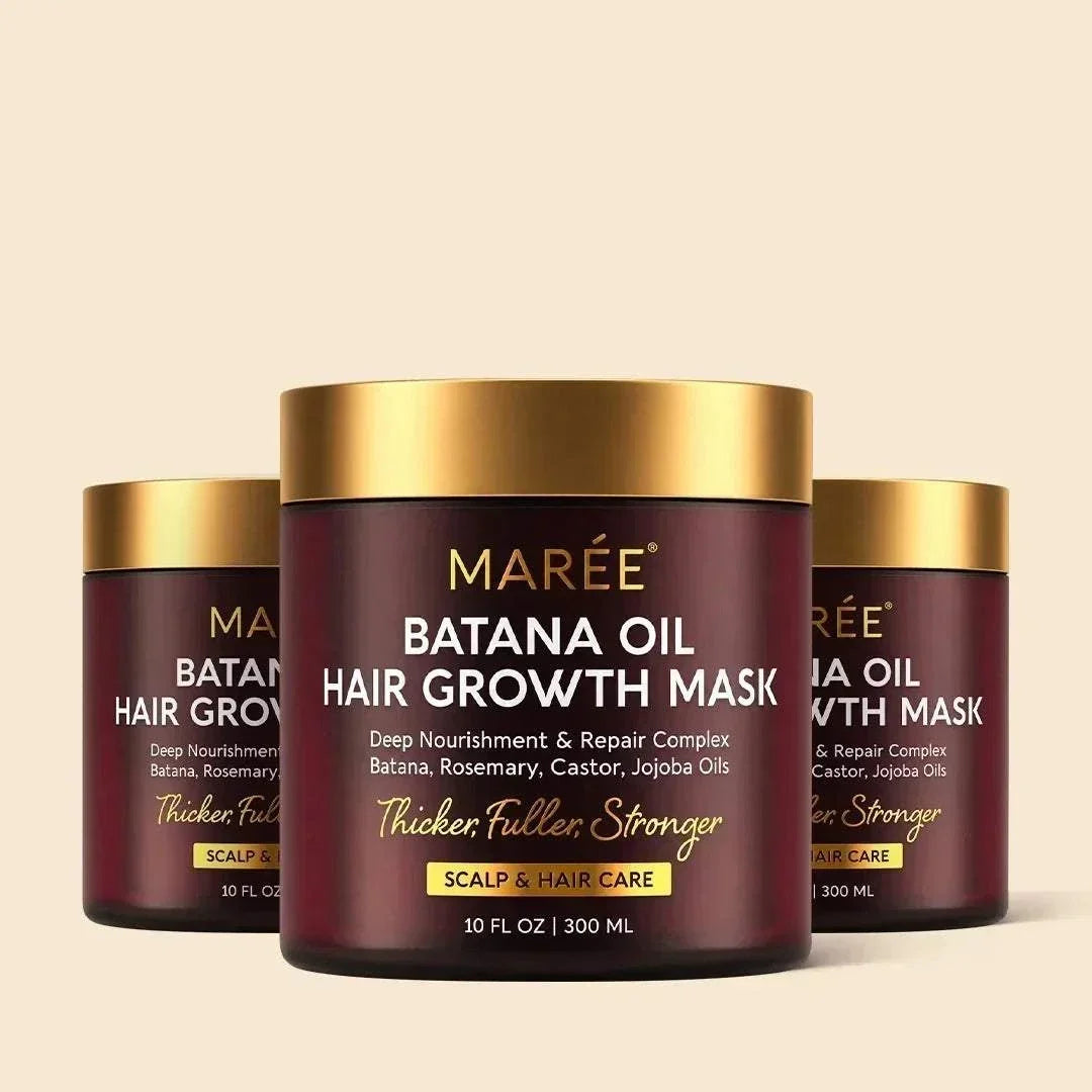 Batana Hair Growth Mask in a burgundy jar with a gold lid, featuring white and gold label text