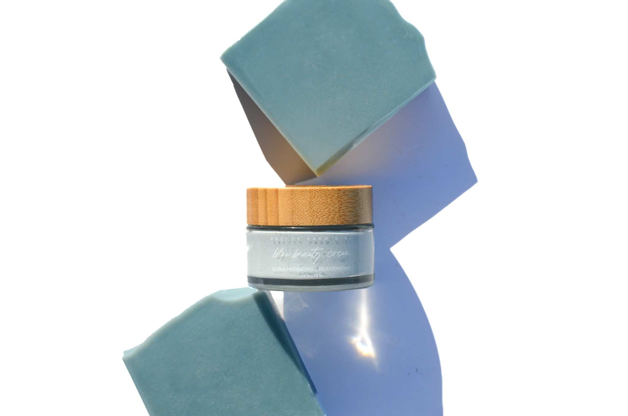 Blue Beauty Cream Facial Bar, blue solid skincare bar with a frosted glass jar and bamboo lid geschniegelt