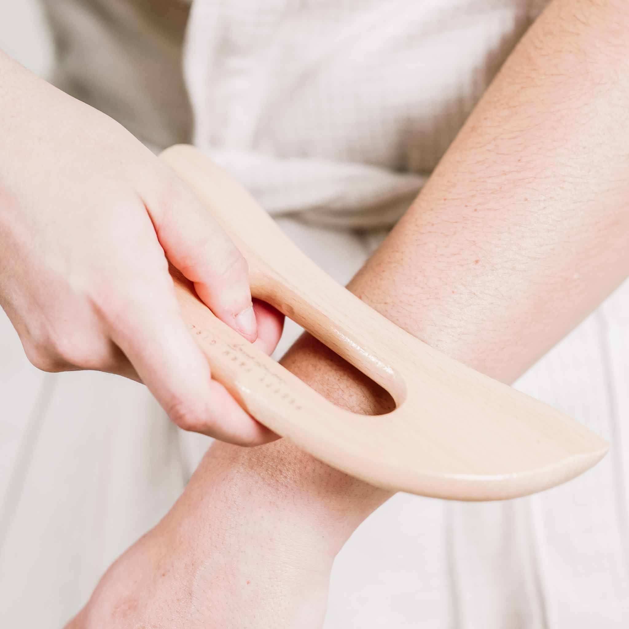 Body Care Lymphatic Routine Kit featuring a smooth natural bamboo gua sha body tool with curved edges