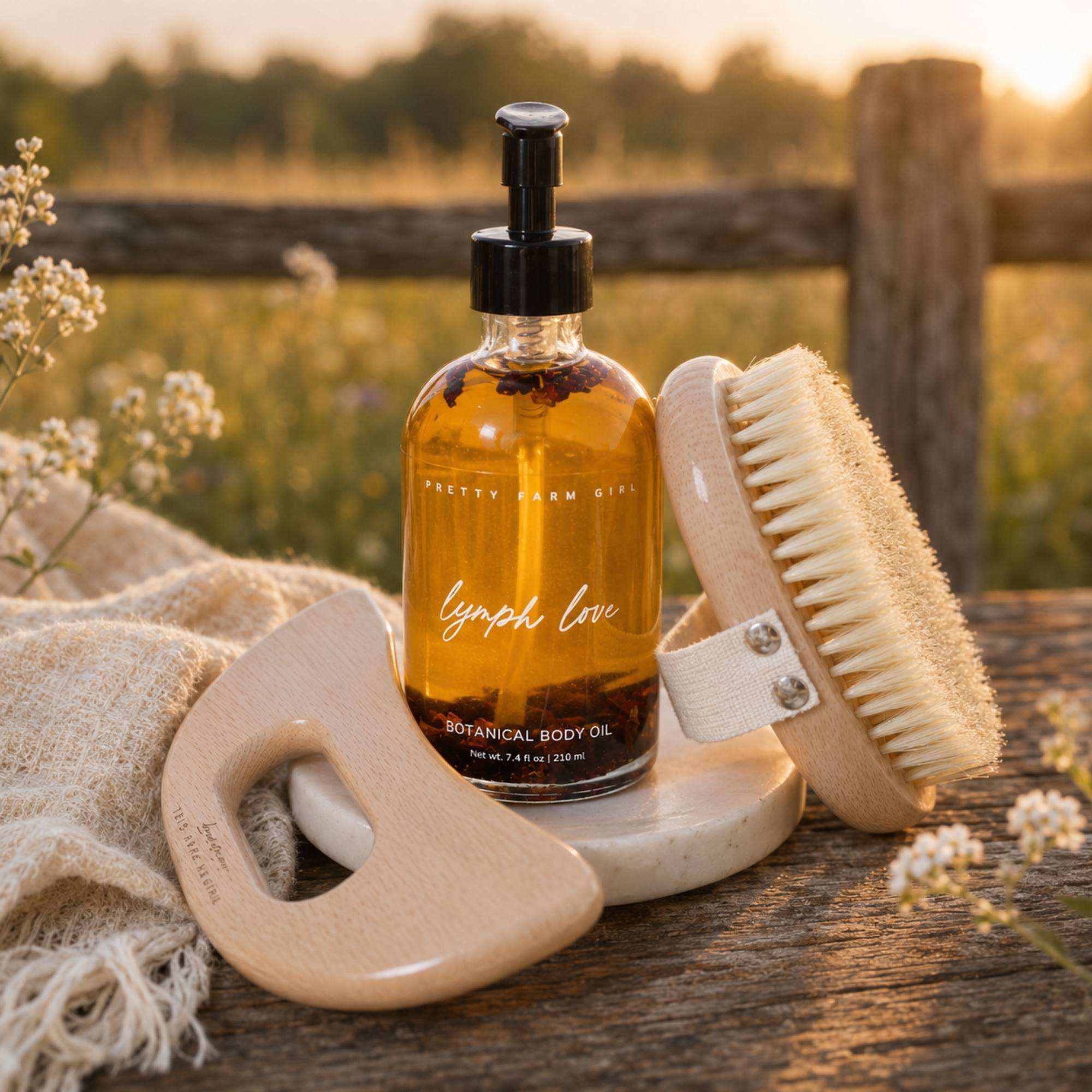 Body Care Lymphatic Routine Kit with amber botanical body oil, bamboo gua sha tool and sisal dry brush set