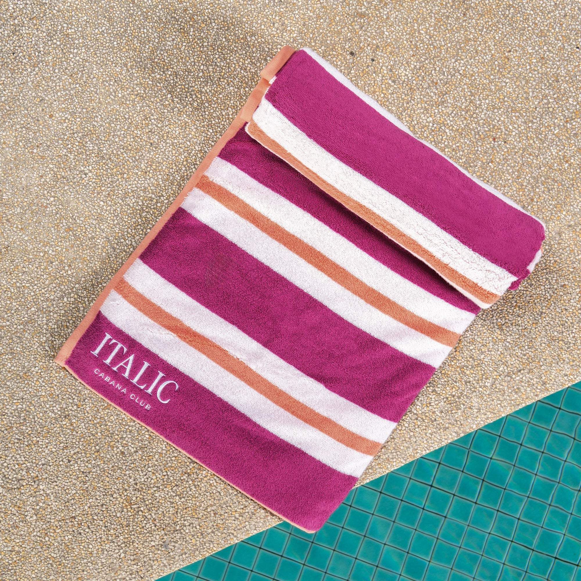 Bondi Australian Cotton beach towel in magenta, white and coral stripes, with an embroidered ITALIC label