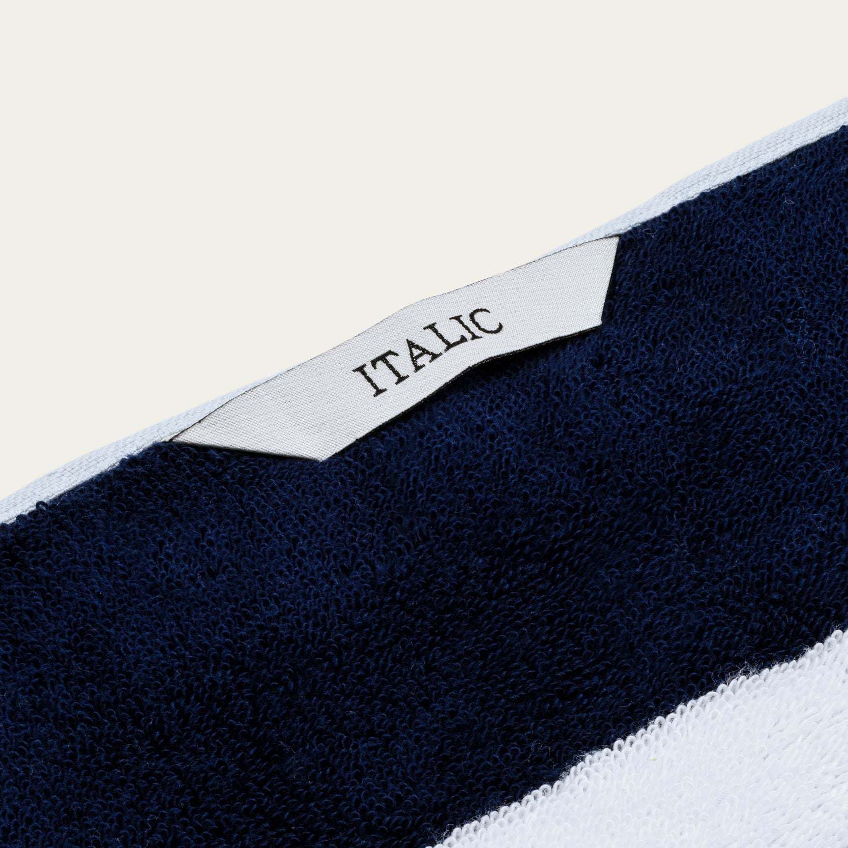 Bondi Australian Cotton beach towel in navy and white with a plush textured weave and woven Taliic label