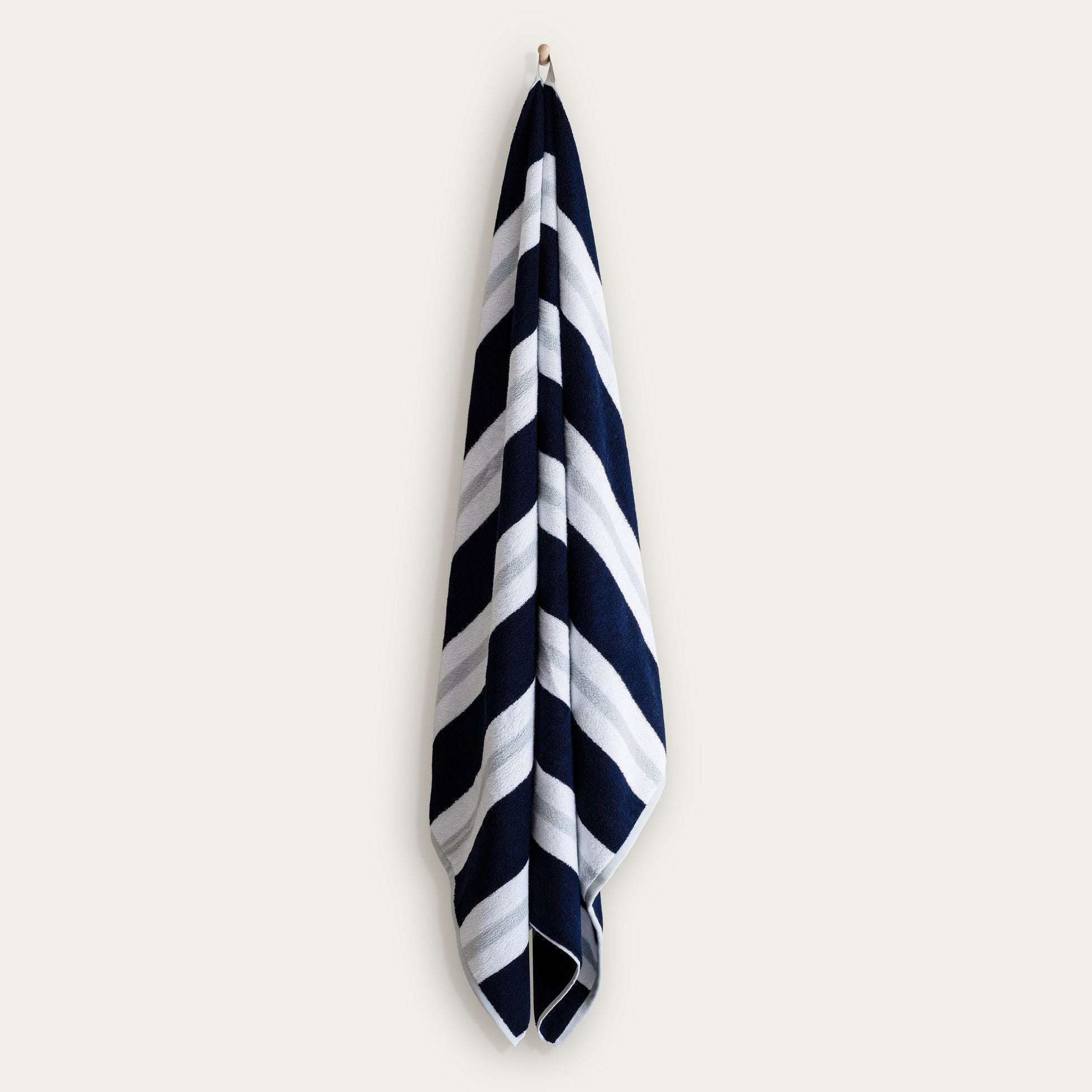 Bondi Australian Cotton beach towel in navy and white with bold diagonal stripes and a plush woven texture