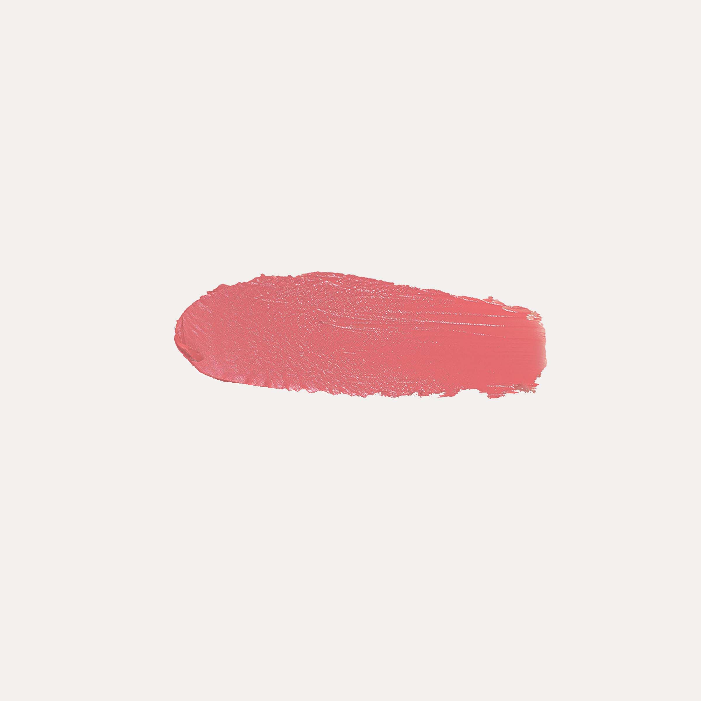 Buildable Cream Blush in a coral pink shade, shown as a creamy, textured swatch with a dewy finish