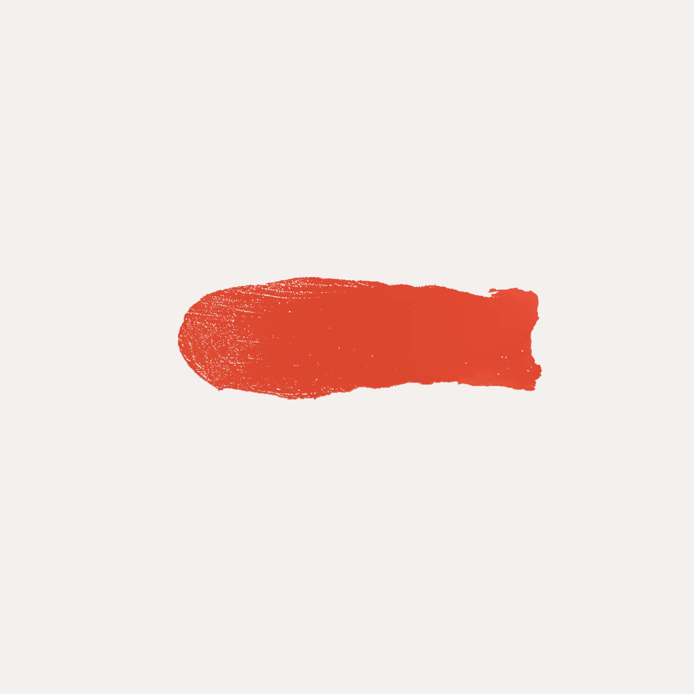 Buildable Cream Blush in a vivid coral-red shade, shown as a silky cream swatch with a textured, painterly finish