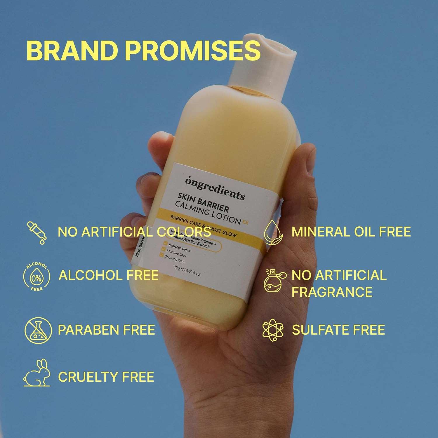 Calming Lotion in a light yellow plastic bottle with white label and white cap, held in a hand with blue background, highlighting brand promises