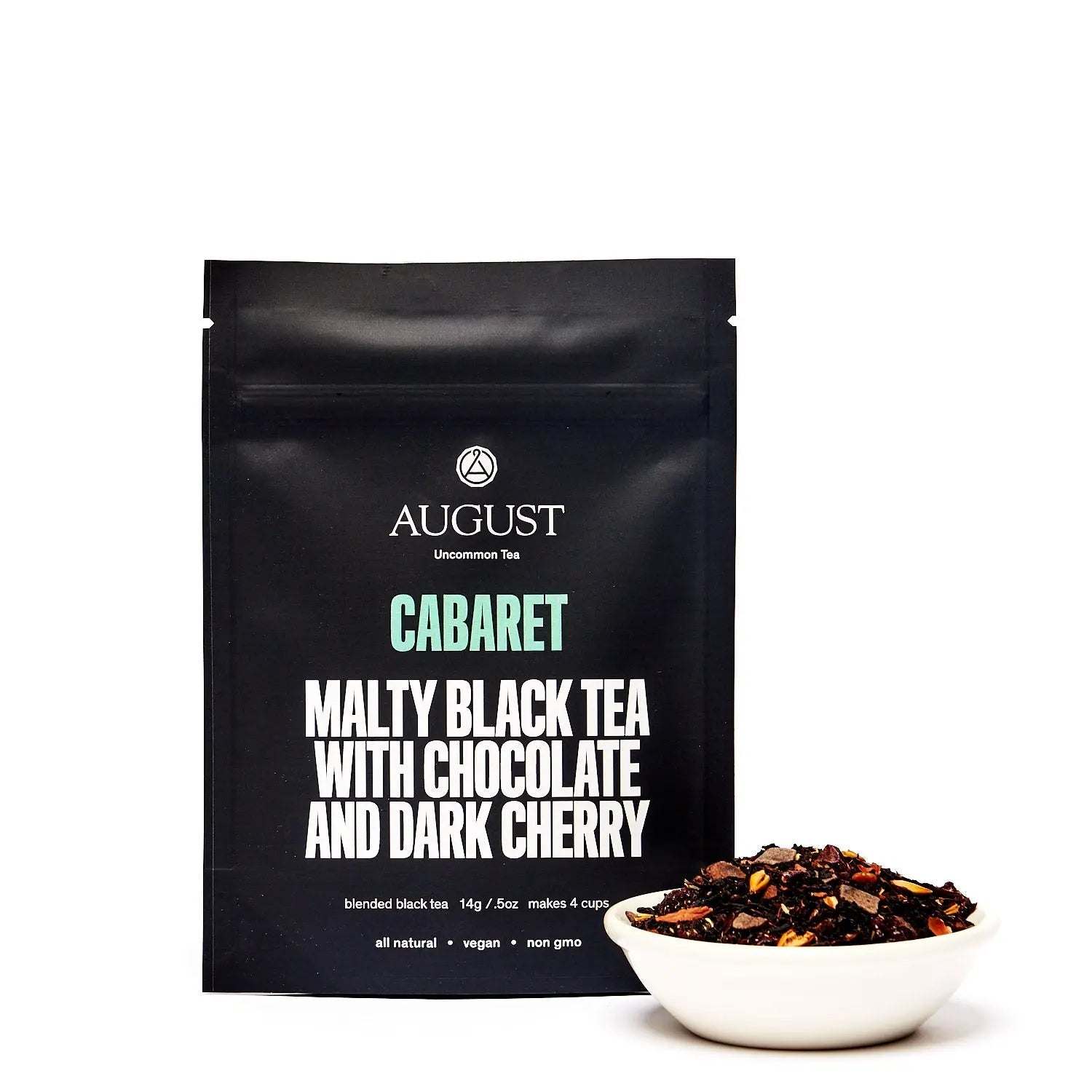 Cherry Chocolate Black Tea in a black Cabaret pouch, with dark tea leaves and cherry pieces in a white bowl