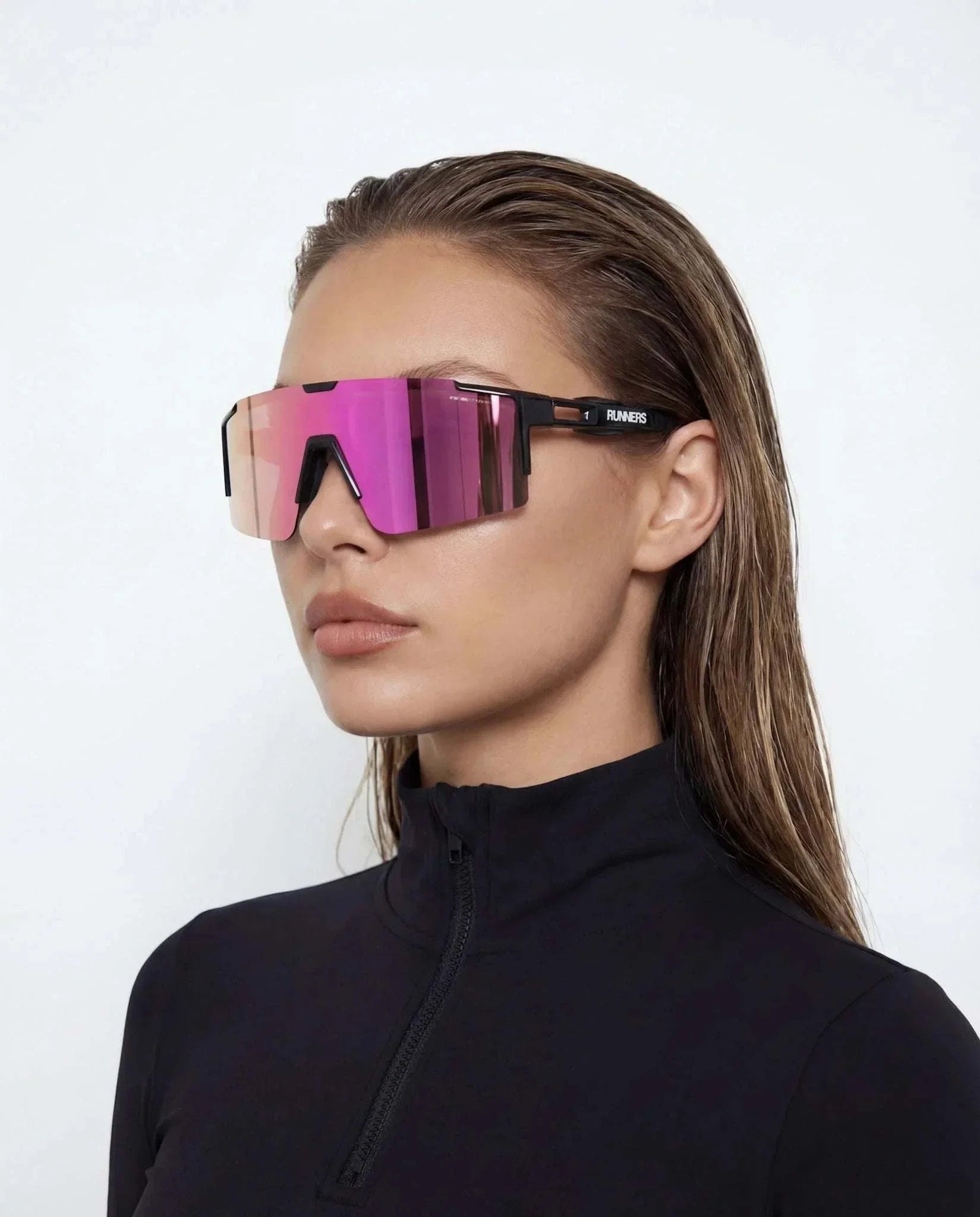 Cherry Pink Polarized Sunglasses with oversized frameless magenta mirrored lenses and slim black temples