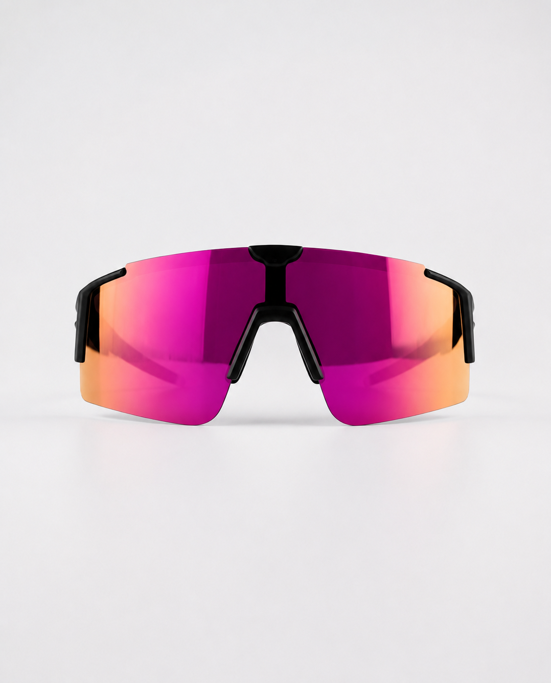 Cherry Pink Polarized Sunglasses with a vivid pink and purple mirrored shield lens, black frameless bridge and temple accents