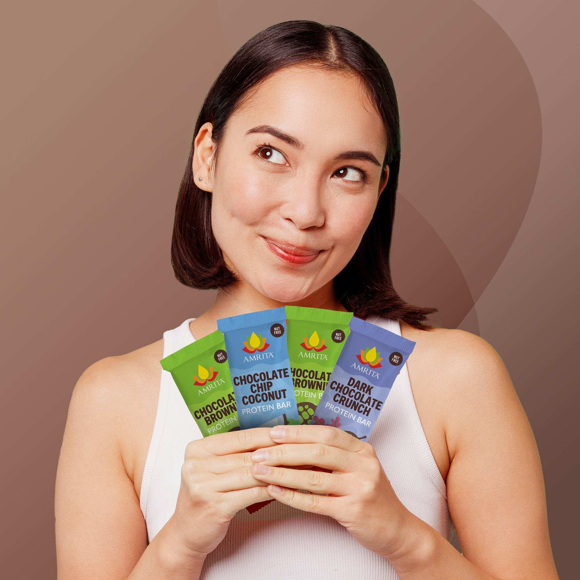 Chocolate Variety Pack of colorful protein bar wrappers in chocolate chip coconut, chocolate brownie and dark chocolate crunch flavors