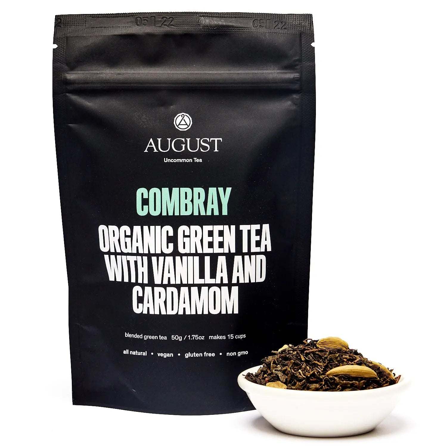 Tea pouch, black packaging with Combray - Vanilla Cardamom Green Tea and loose green tea in a white bowl