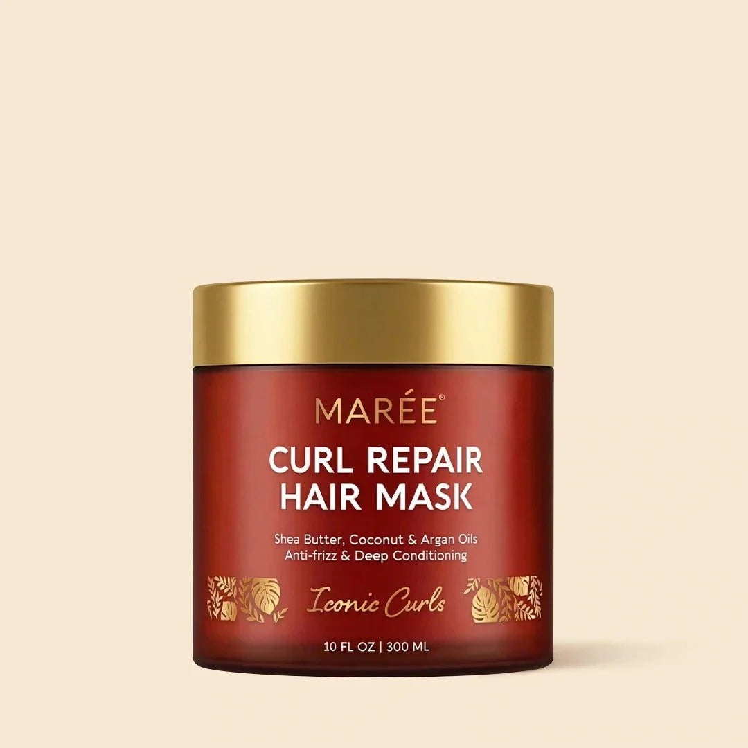 Curl Repair Hair Mask in a deep red jar with a gold lid, labeled with gold botanical motifs and curl care details
