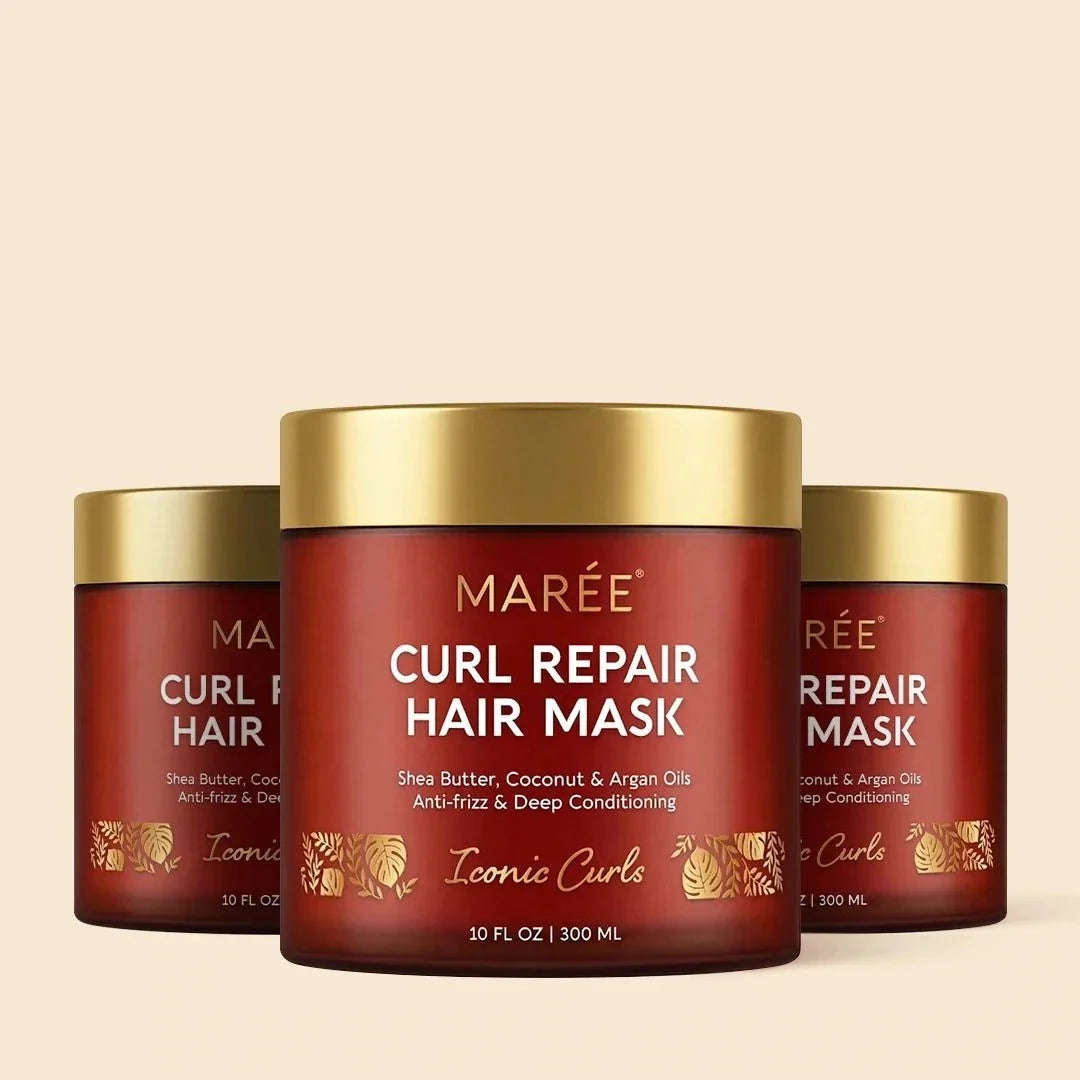Curl Repair Hair Mask in a red-brown jar with a gold lid, featuring white lettering and gold botanical details