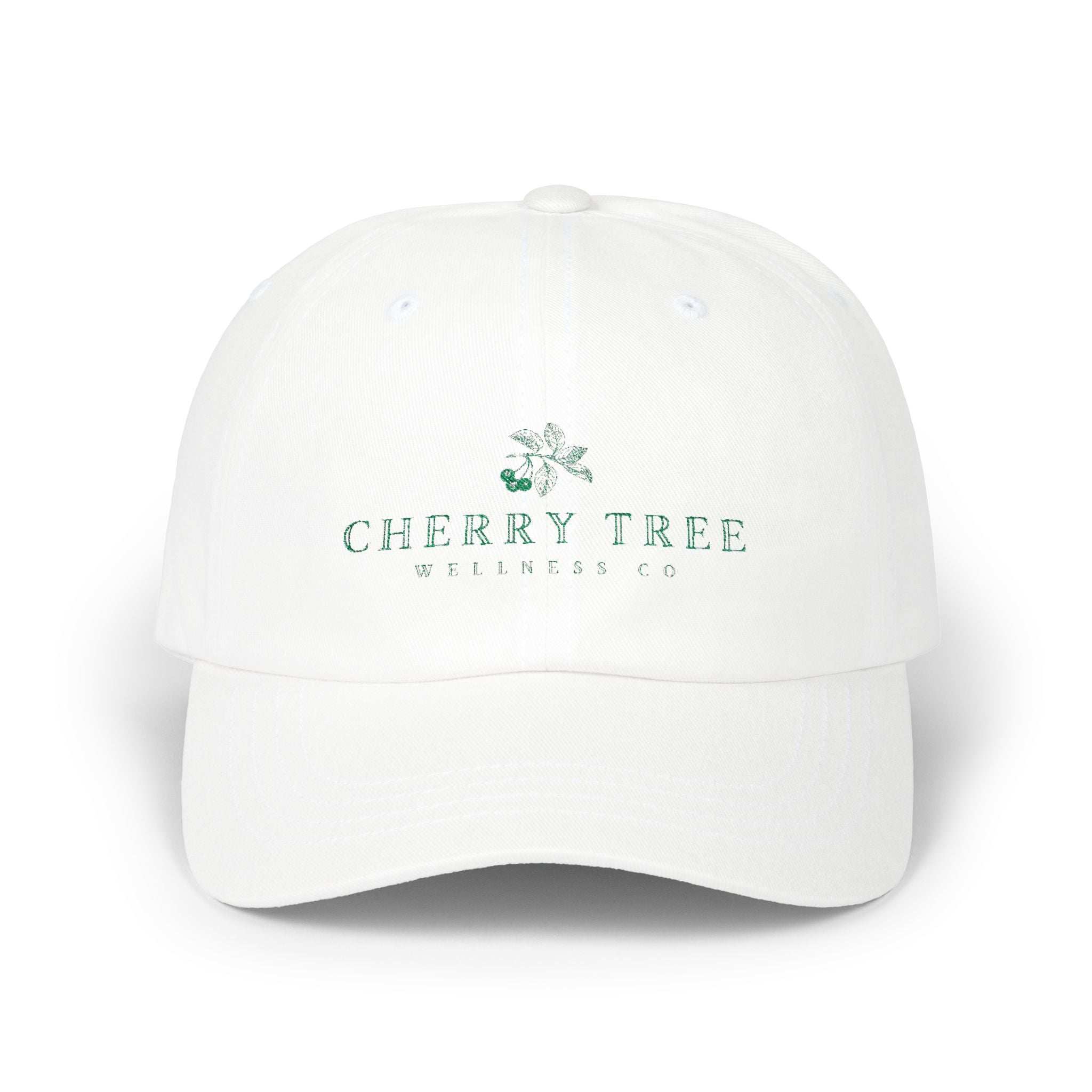 Dad Cap in white cotton with green embroidered Cherry Tree Wellness Co. logo on front and curved visor