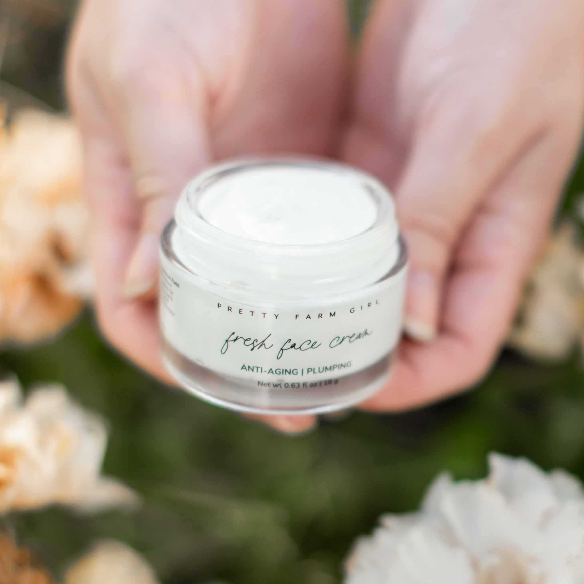 Dark Spot Brightening Kit featuring a clear glass jar of white Fresh Face Cream with a minimalist label