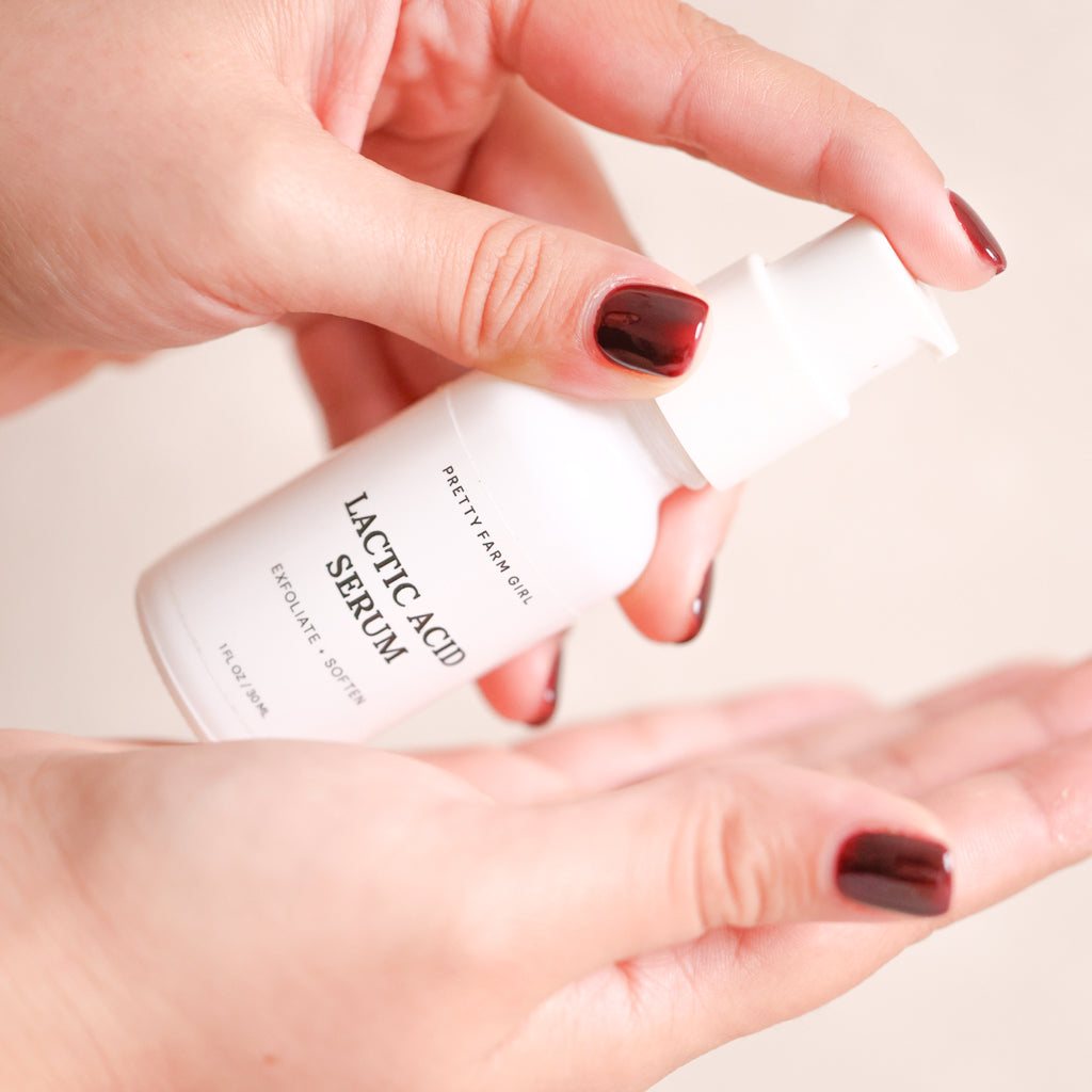 Dark Spot Brightening Kit featuring a white lactic acid serum bottle with a pump dispenser and minimalist label
