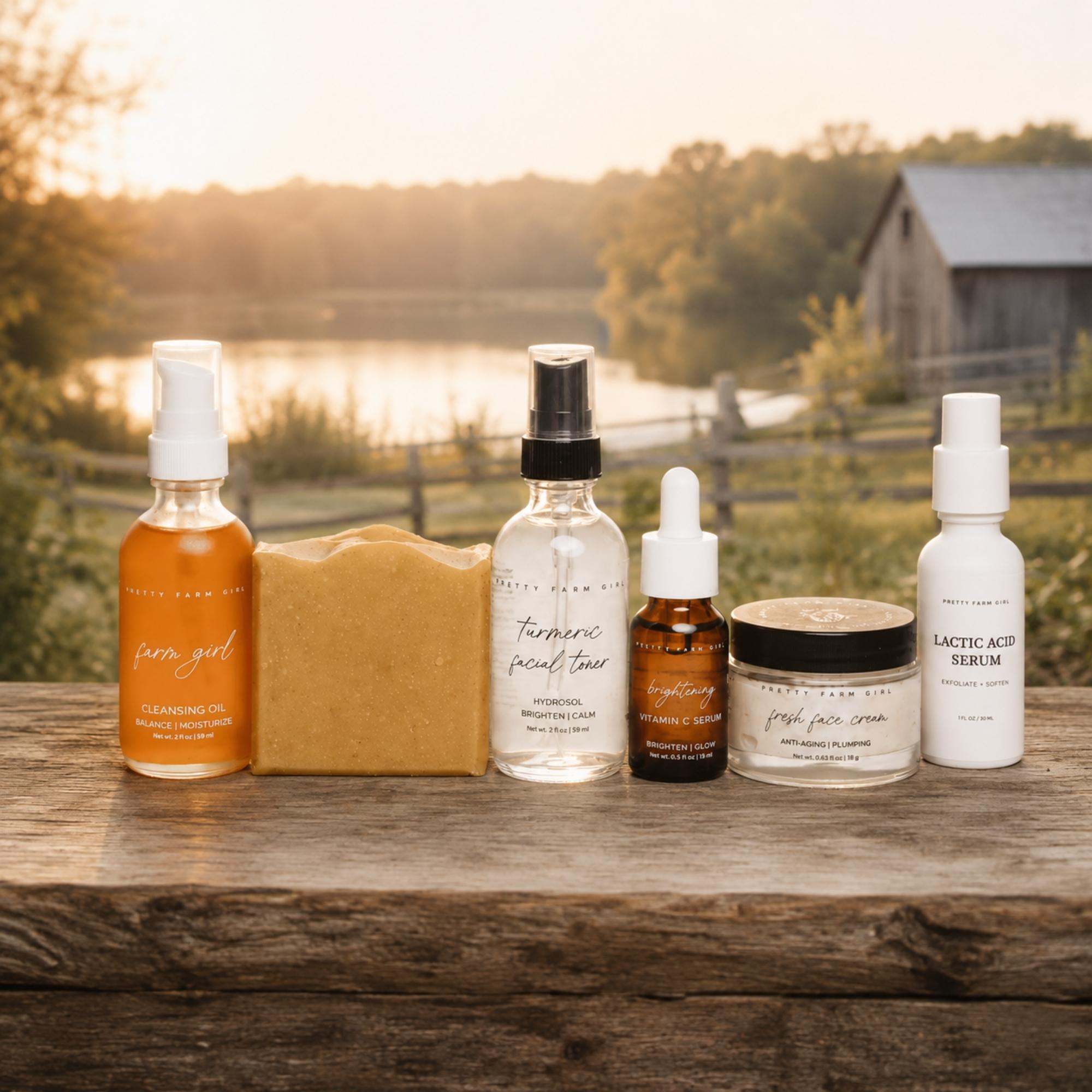 Dark Spot Brightening Kit with orange cleansing oil, turmeric soap, toner, serum, face cream, and lactic acid serum