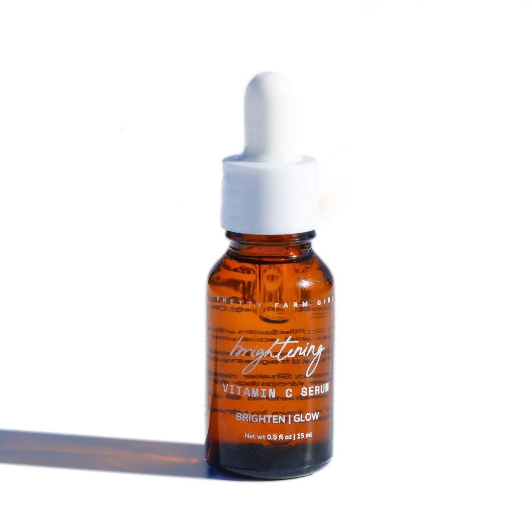 Dark Spot Brightening Kit featuring an amber glass vitamin C serum bottle with white dropper cap