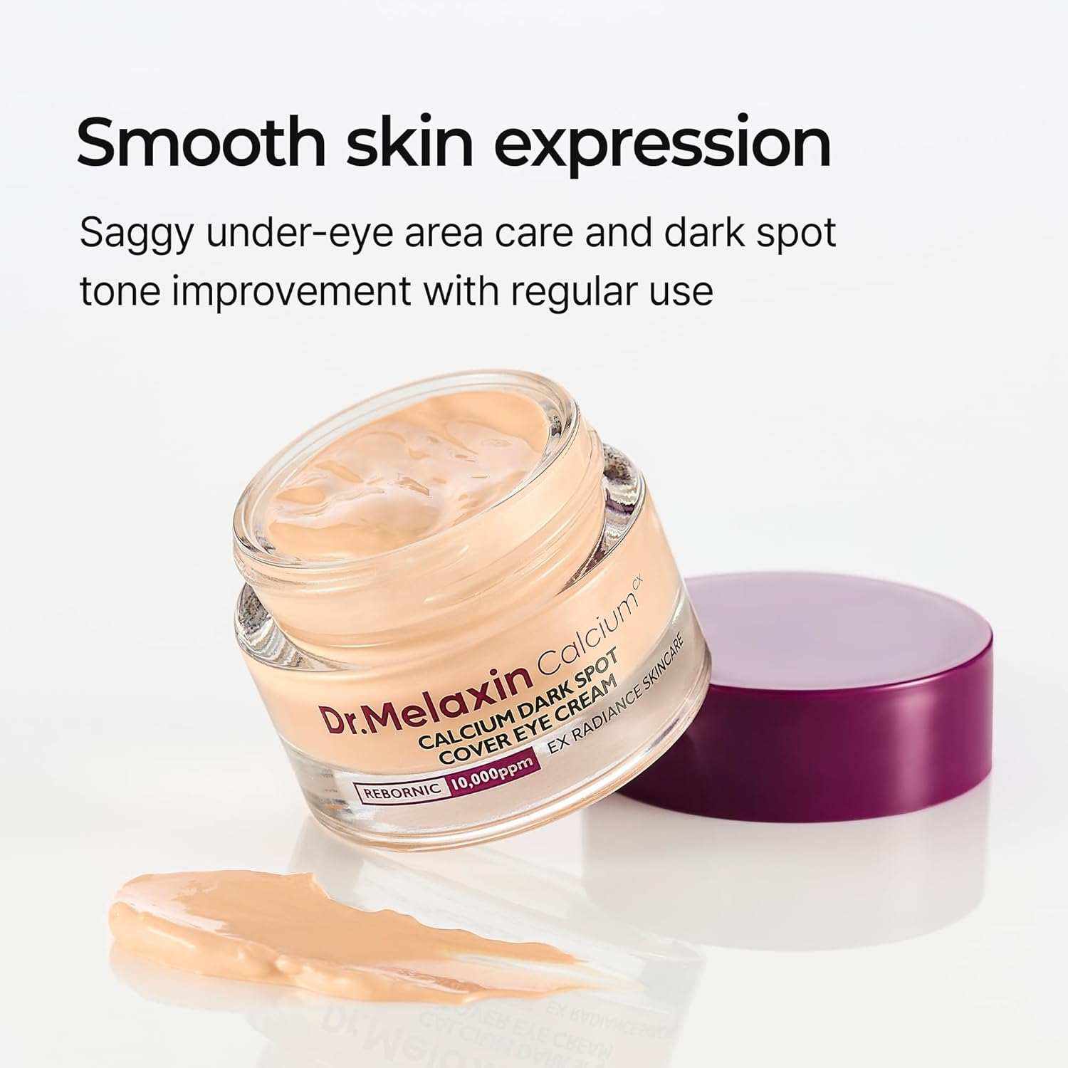 Dr. Melaxin Calcium Dark Spot Cover eye cream in a glass jar with beige cream, purple lid, and smooth texture
