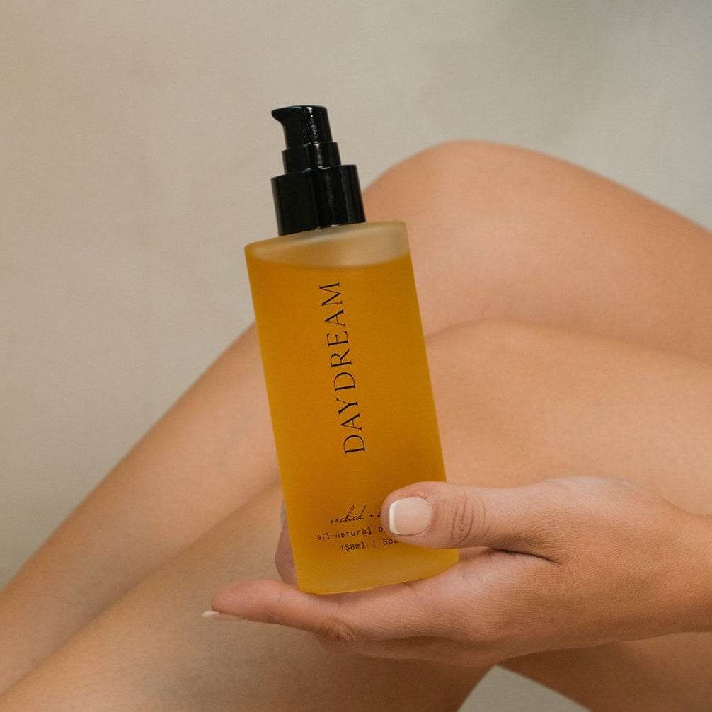 DAYDREAM all-natural body oil bottle with orange and neroli scent