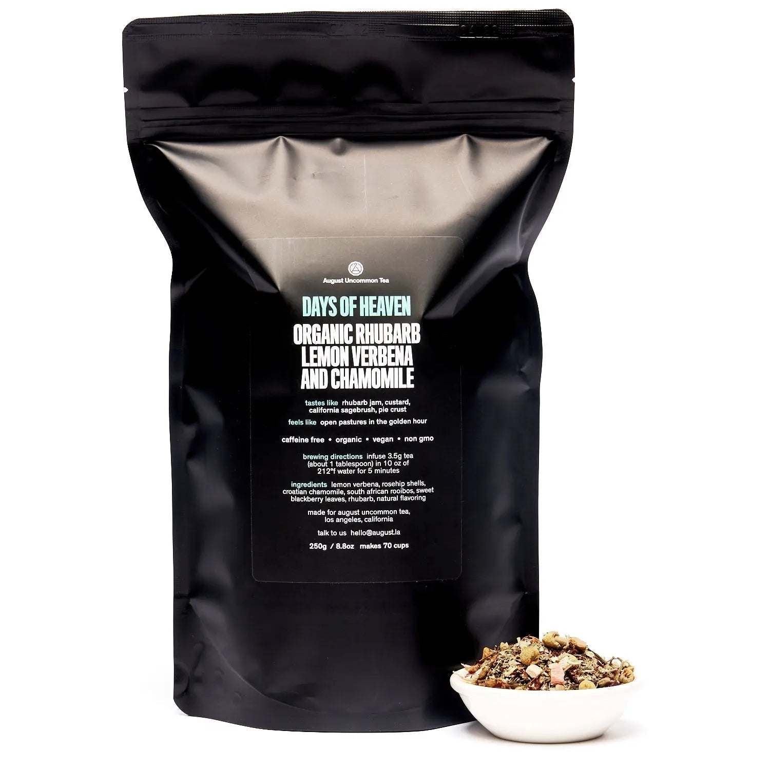 Days of Heaven tea in a black resealable pouch with a label and a small bowl of loose herbal tea