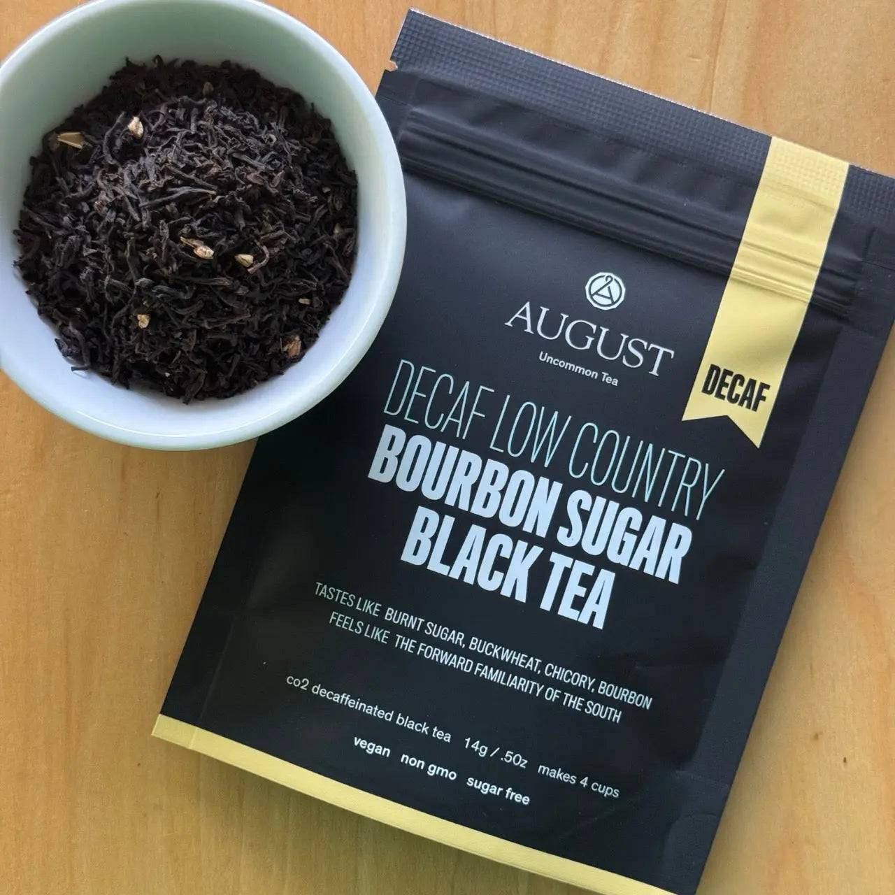 Decaf Low Country - Black Tea bourbon sugar black tea in a black package with loose dark tea leaves
