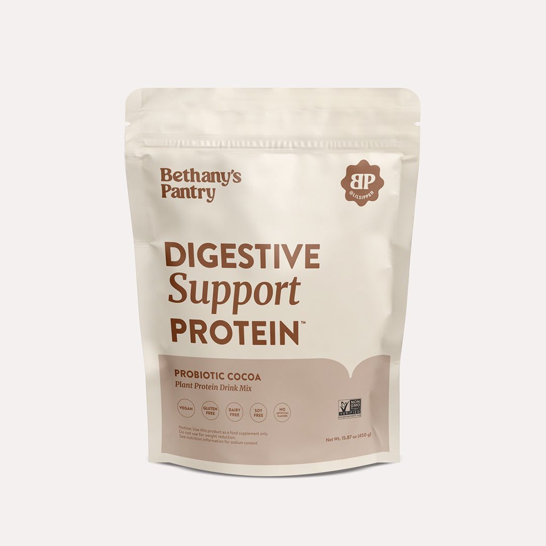 Digestive Support Protein pouch in cream and brown, with a resealable top and bold lettering for probiotic cocoa plant protein drink mix.