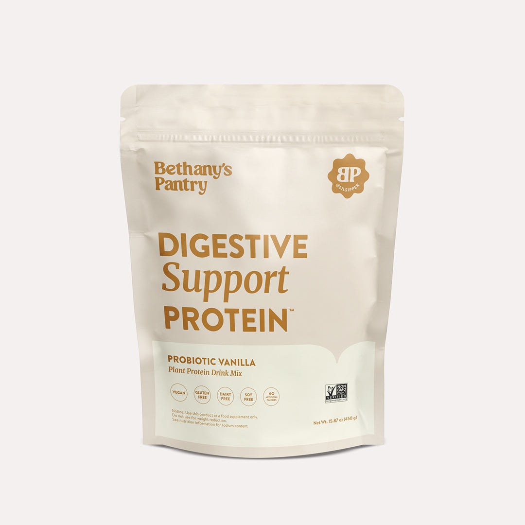 Digestive Support Protein in a cream resealable pouch with brown lettering and a probiotic vanilla plant protein label