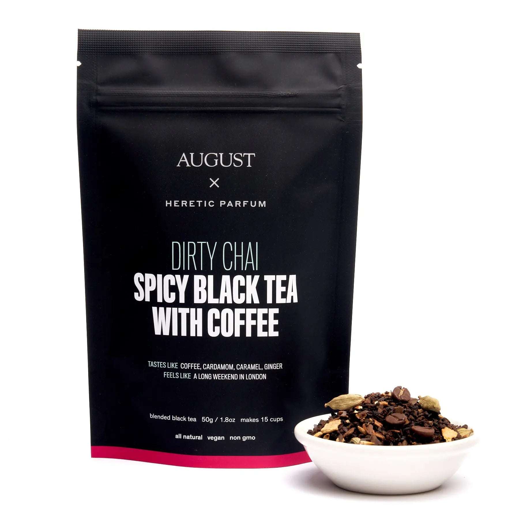 Dirty Chai spicy black tea in a matte black resealable pouch beside a bowl of loose tea with coffee and spices